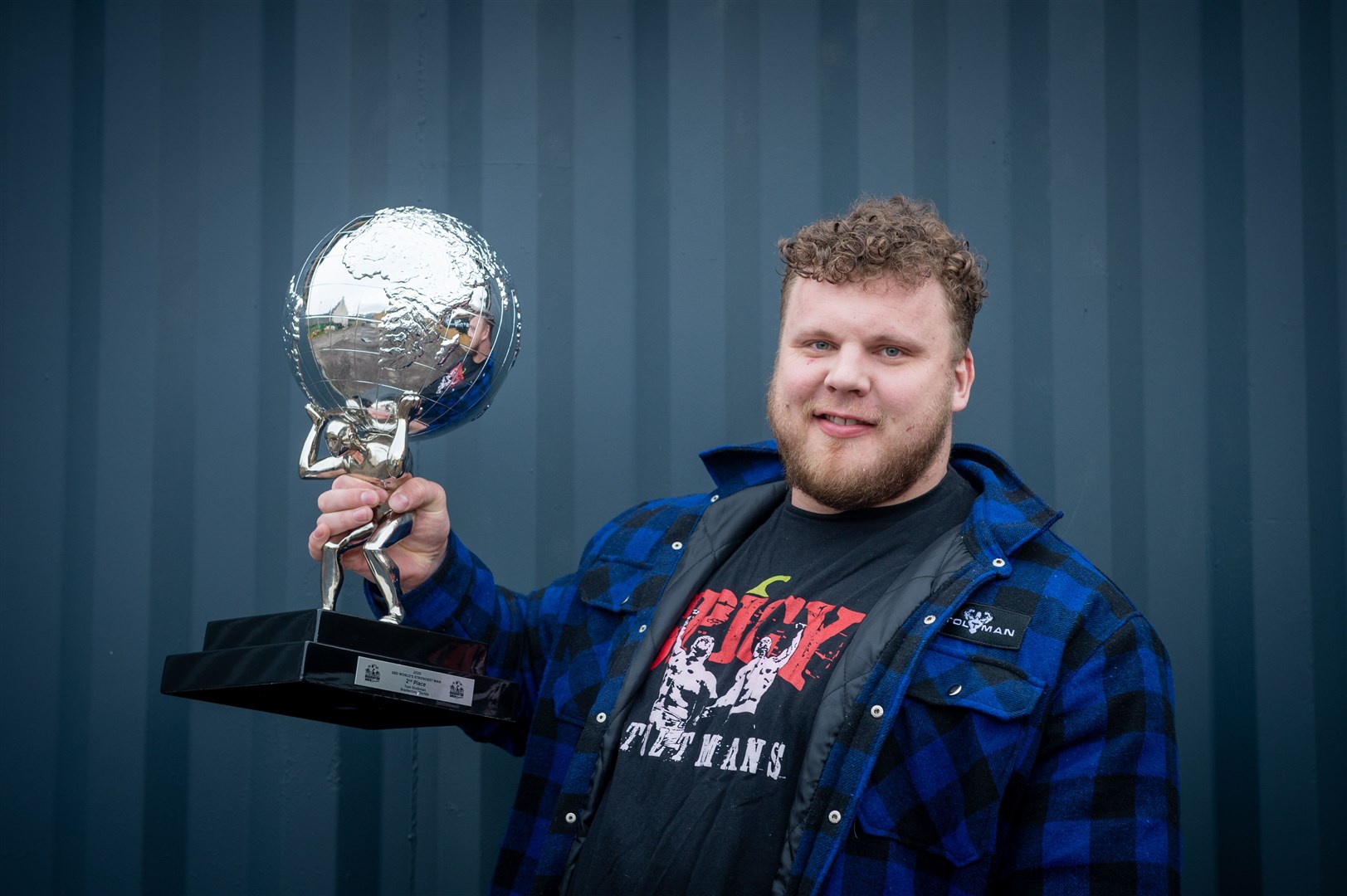 Tom Stoltman with the trophy he has now finally received from the US from his runner-up slot in World's Strongest Man comp..
