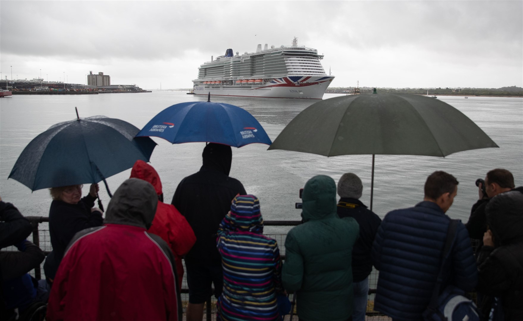 Members of the public braved the rain to watch the ship’s arrival (Andrew Matthews/PA)