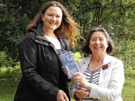 Wester Ross Highland councillor Audrey Sinclair presents Emma Bennett-West with her prize of a camera.