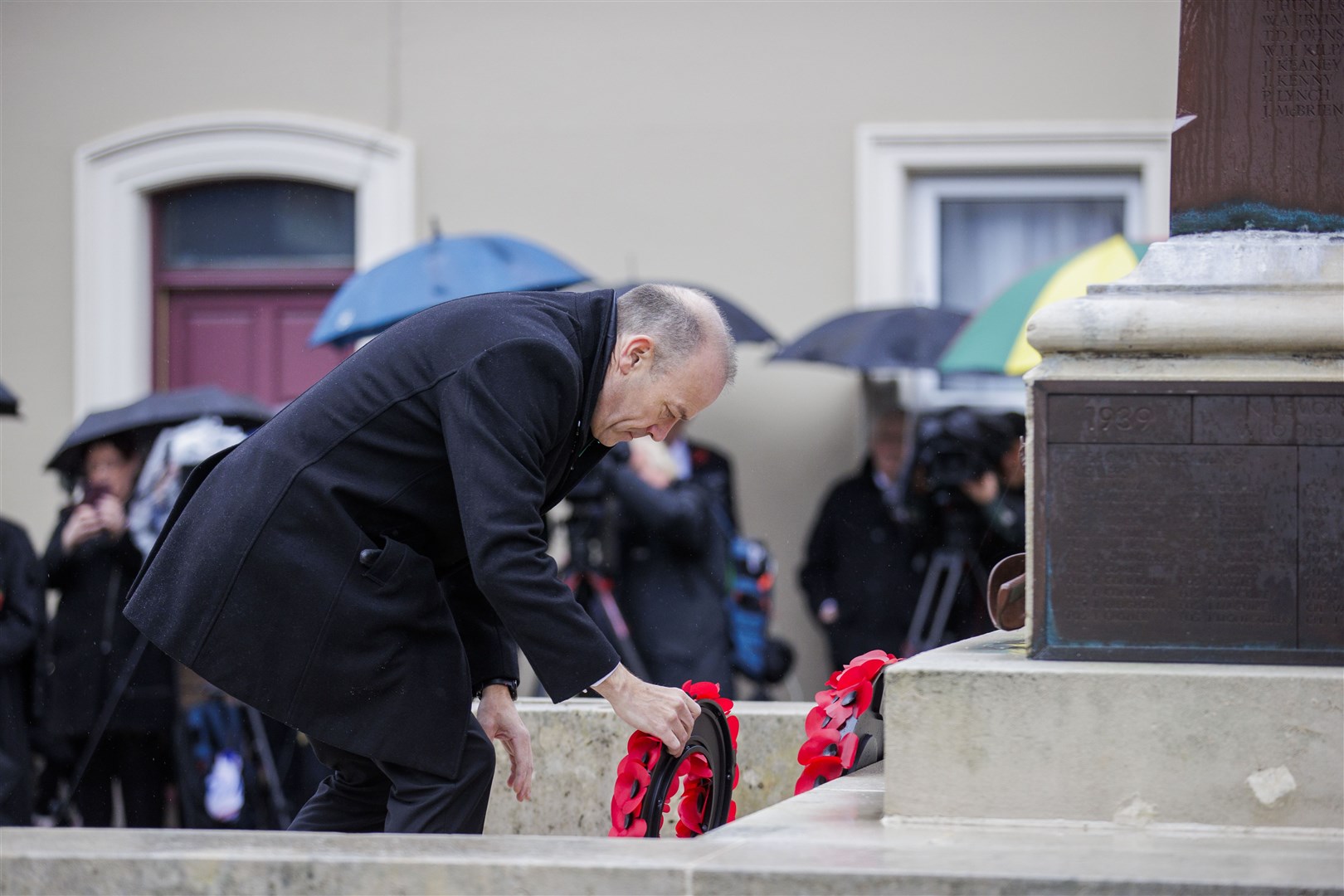 Northern Ireland Secretary Chris Heaton-Harris lays a wreath (Liam McBurney/PA)