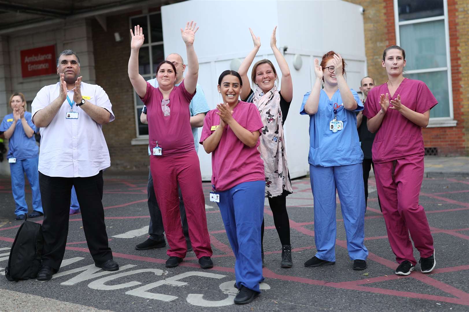 NHS staff outside King’s College Hospital in south London, join Clap for Carers (Yui Mok/PA)