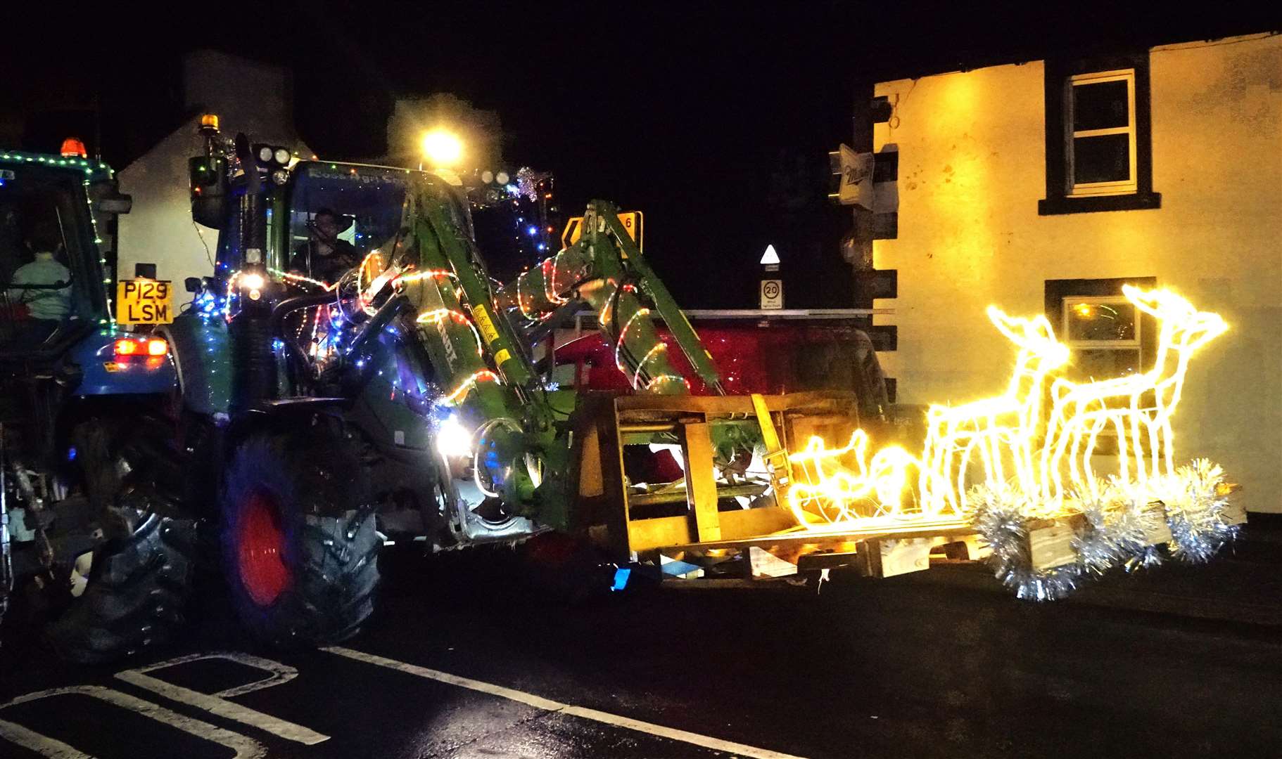 Young Farmers centenary tractor run travels through Watten on its way to Wick. A similar event to the Tractor Run taking place in Ross-shire on December 30. Picture: DGS