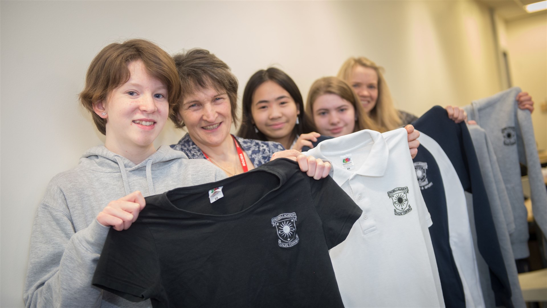Dingwall Academy students set to arrange a pop-up shop at their forthcoming spring fair to sell used uniforms as a way to make some money for school funds and be environmentally friendly. ..Rhea Porter (s3), Lizbeth Collie (Parent), Emily Tham (s3), Lauren Blakburn (s3) and Karen O'hanlon (Parent Council)...Picture: Callum Mackay. Image No. 043299.