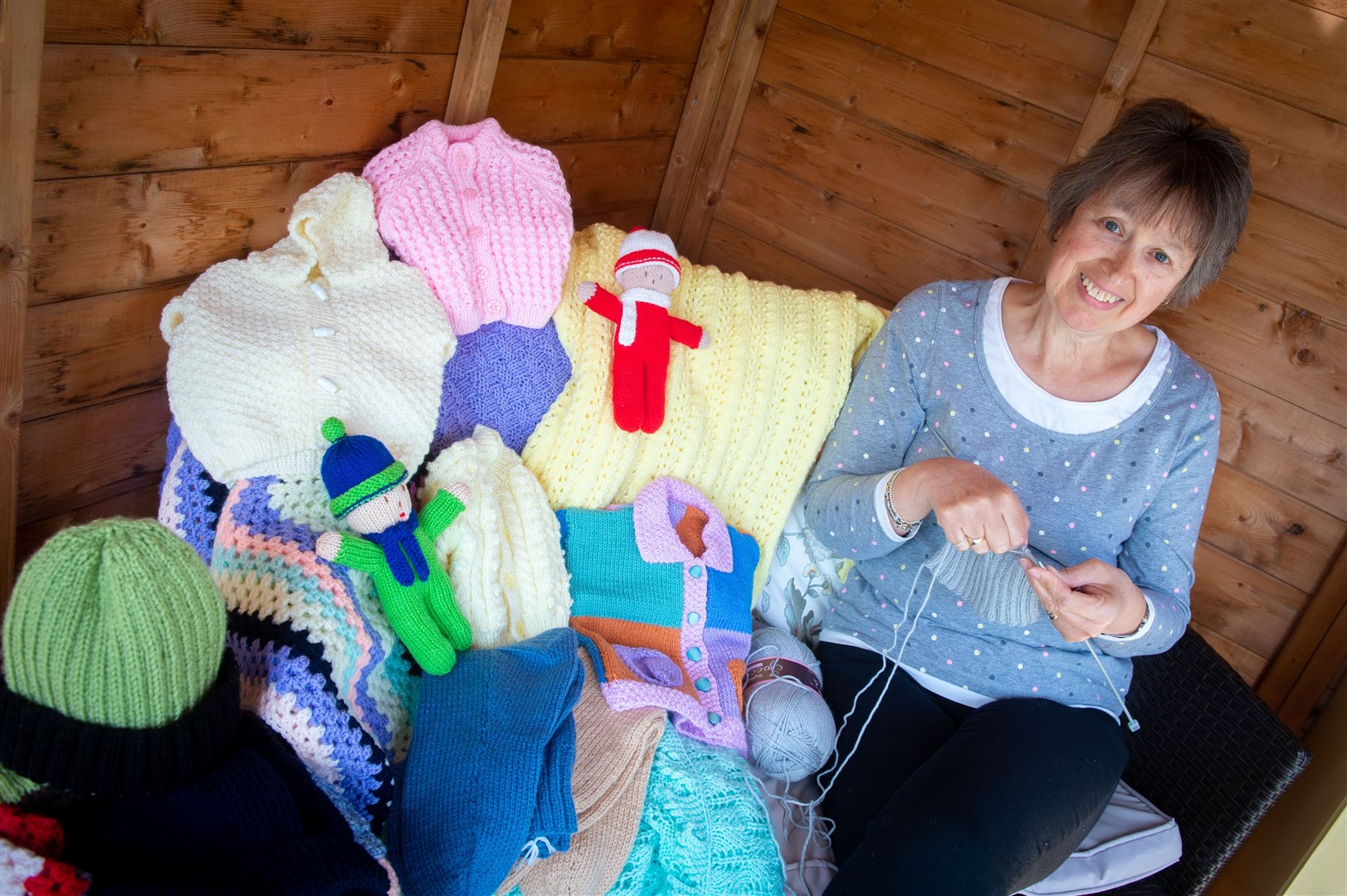 Shona Docherty, president of Highland branch of Queen Mother's Clothing Guild, making hand crafted jumpers and socks for those in need. Picture: Callum Mackay.