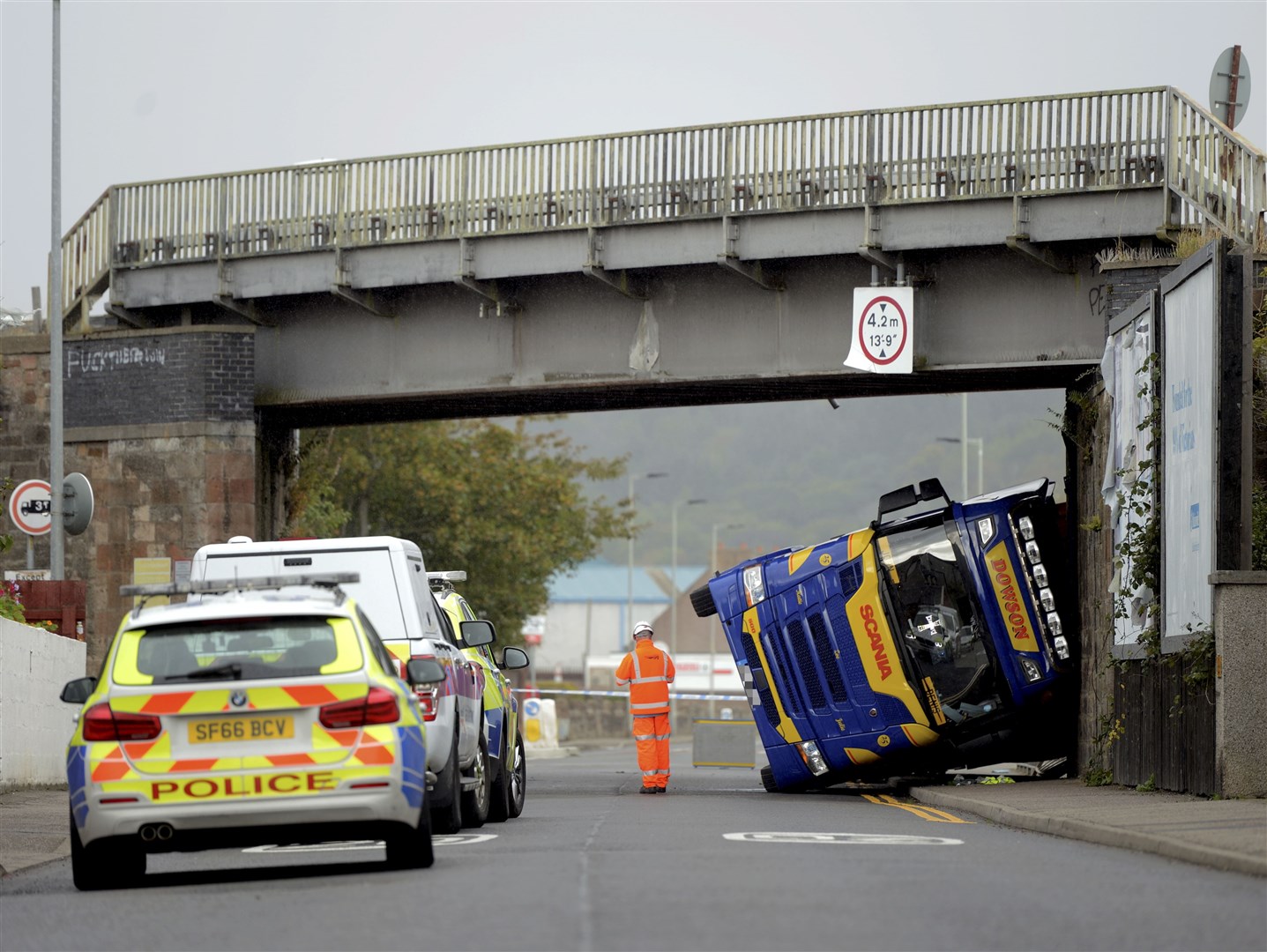 The road was closed for several hours after the lorry hit the rail bridge in Lower Kessock Street.