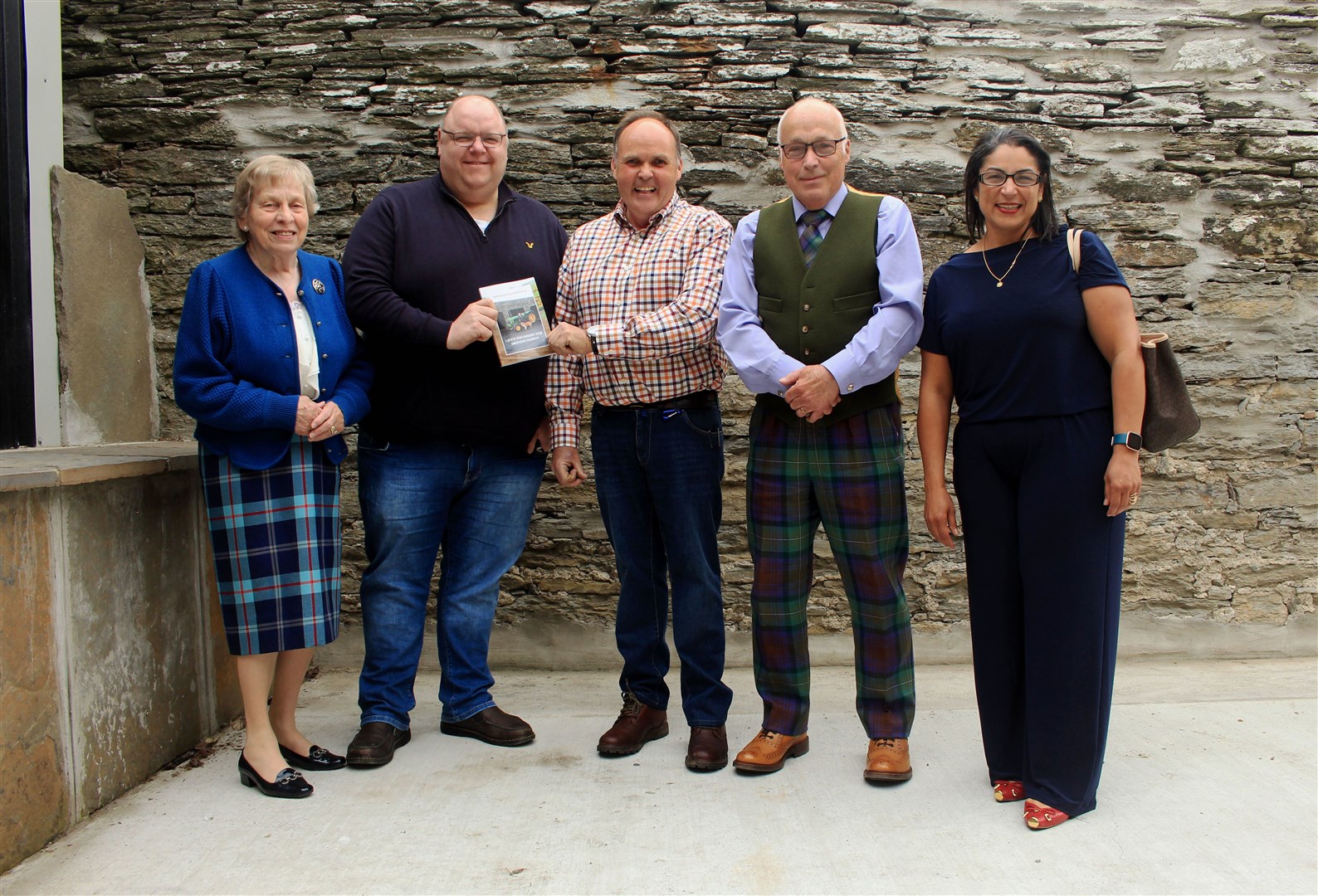 Donald MacDonald (centre) with (from left) Susan Somerset, Calum Adams, Peter Somerset and Elizangela Robertson at the book launch in Thurso. Picture: Alan Hendry