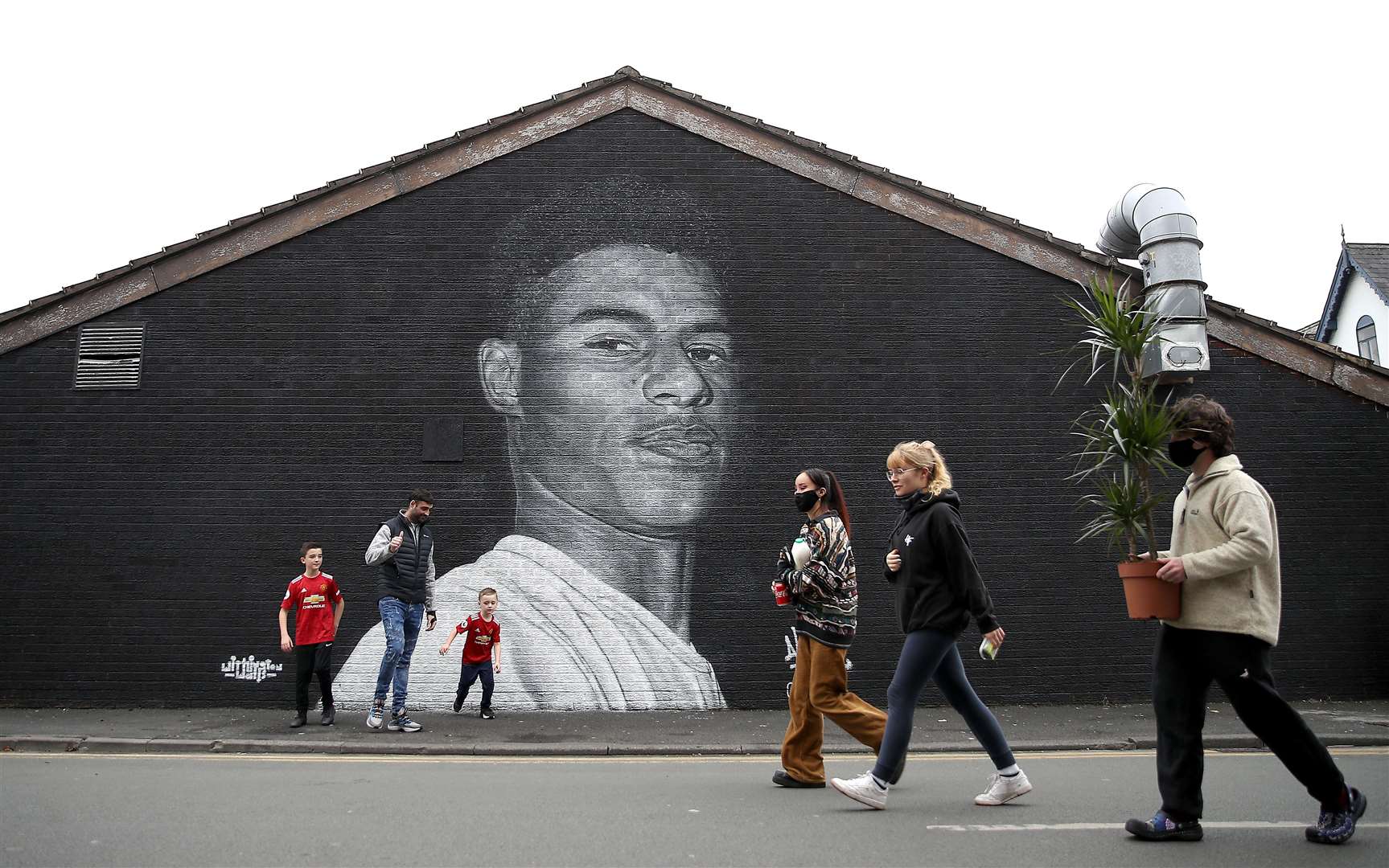 A mural of the striker by street artist Akse on a wall in Withington, Manchester (Martin Rickett/PA)