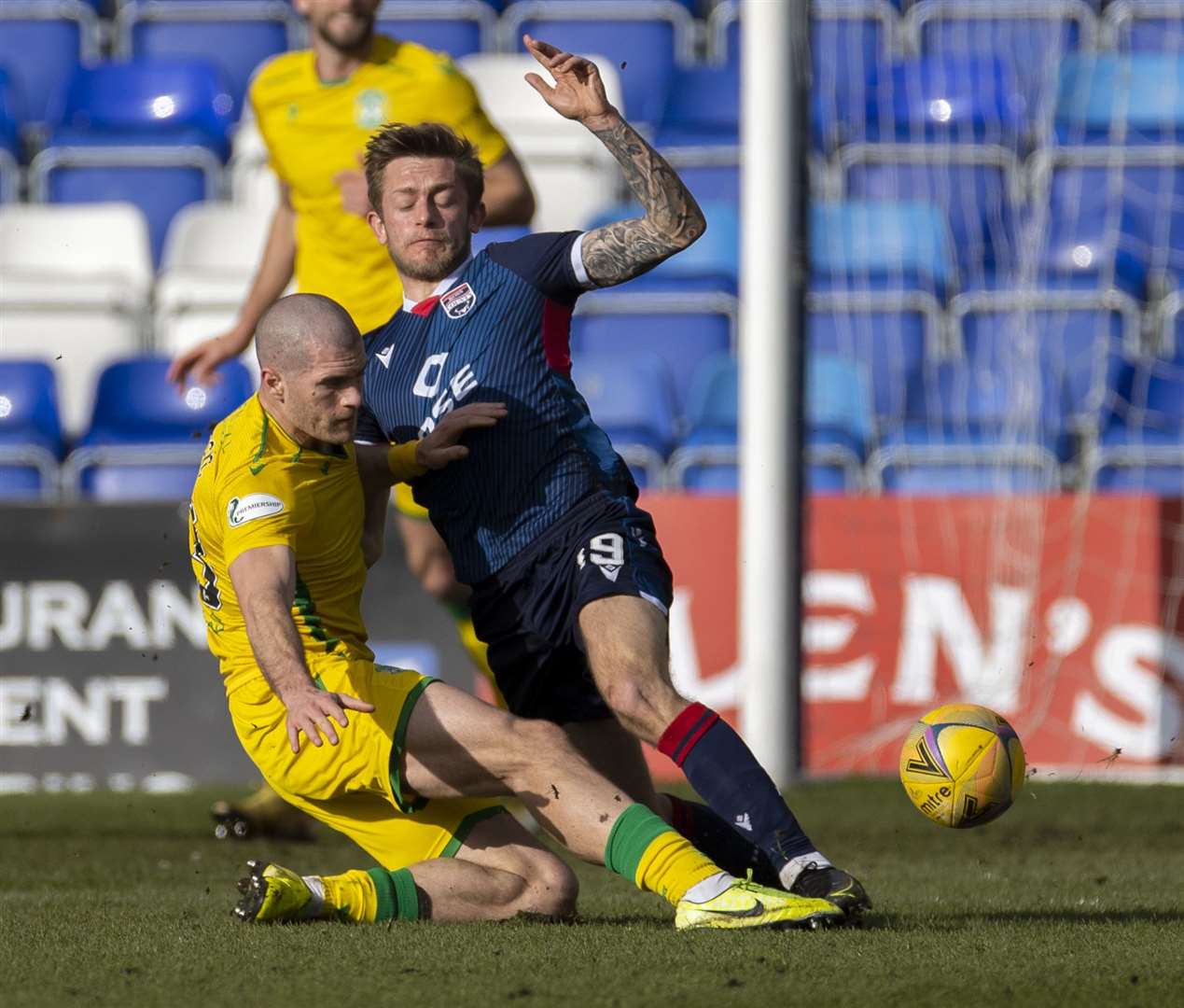 Picture - Ken Macpherson, Inverness. Ross County(1) v Hibs(2). 13.03.21. Ross County's Charlie Lakin clears danger from Hibs’ Alex Gogic.