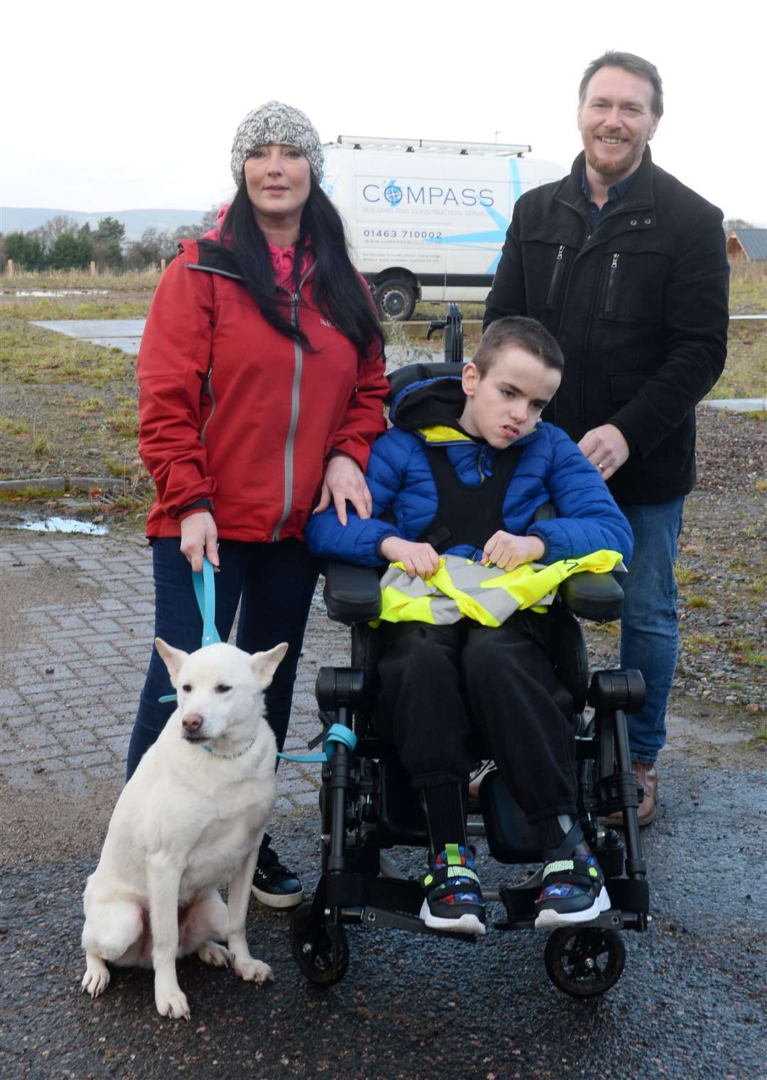 Amanda, Tobias and Kyle Leask with family dog, Miracle, at the Haven Centre site.