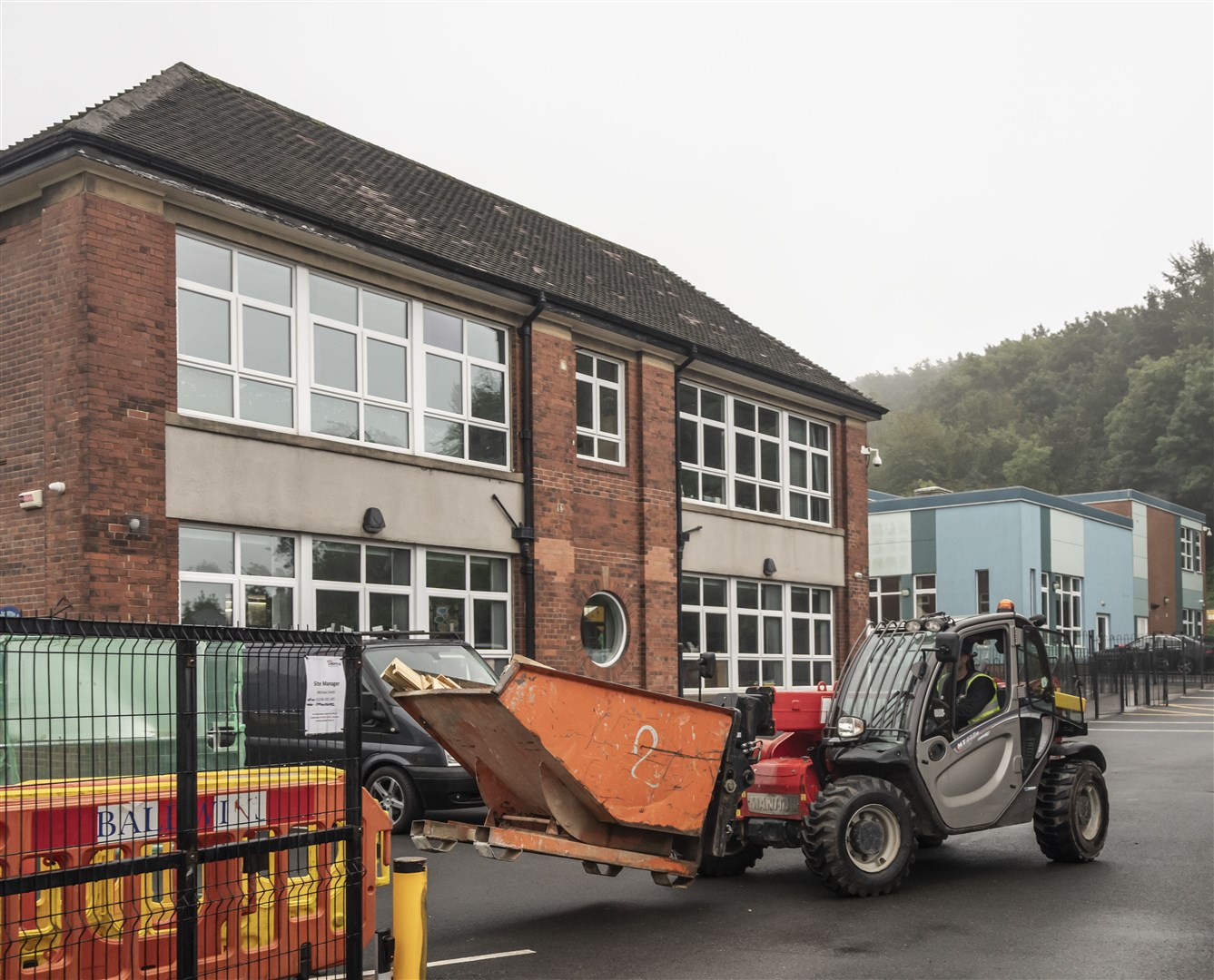 Workmen at Abbey Lane Primary School in Sheffield, where problematic Raac has been found (Danny Lawson/PA)