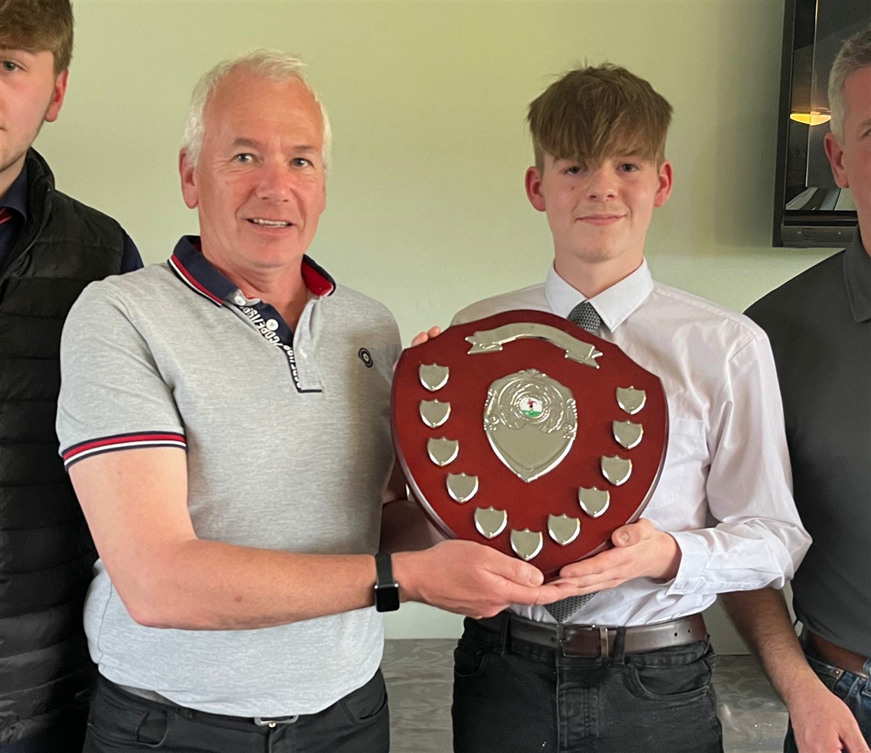 The Tain and Easter Ross Rotary Club Shield was presented to most improved player Billy Knox, by Rotary member William Cowie.