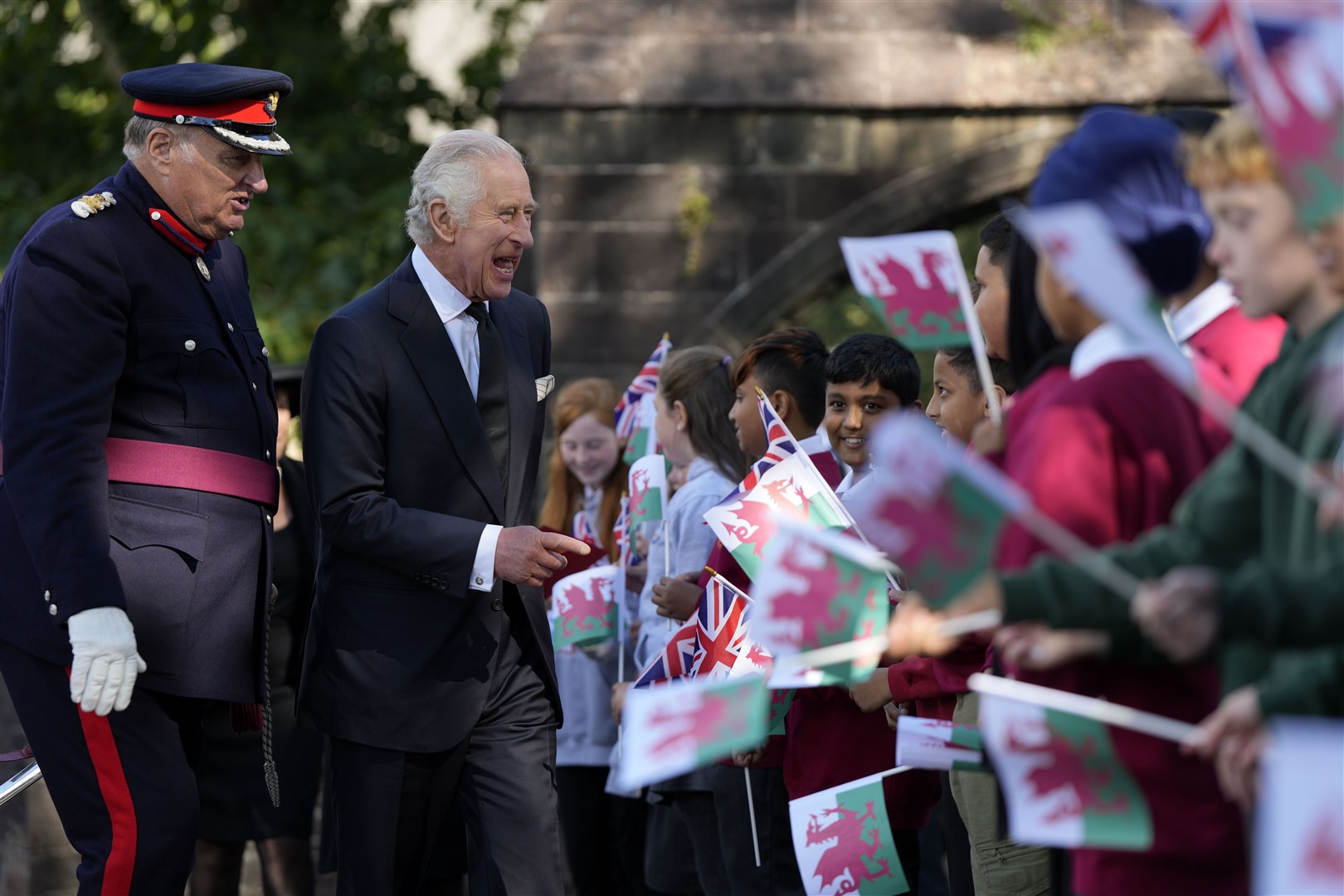 Charles met members of the local community on a walk around Cathedral Green (Frank Augstein/PA)
