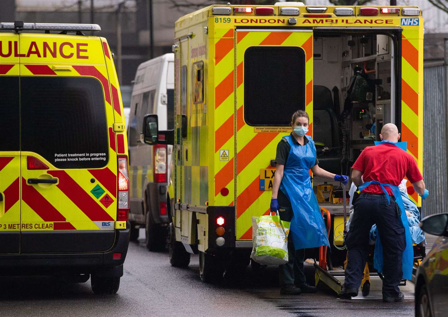 Paramedics unload a patient from an ambulance outside the Royal London Hospital (Dominic Lipinski/PA)