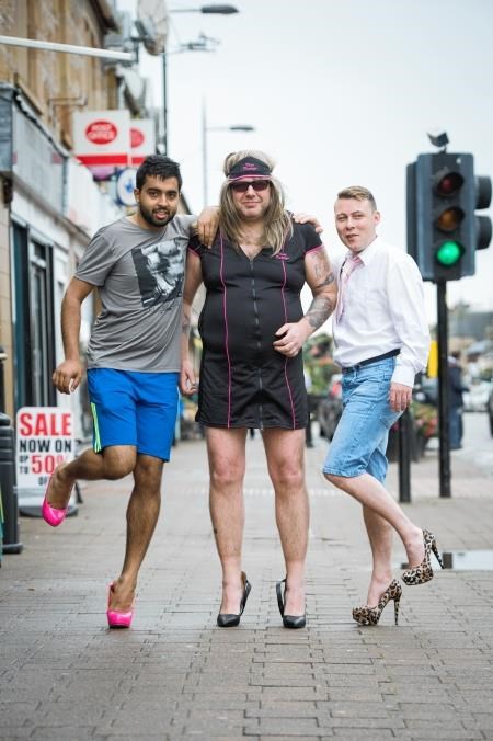 Loving their new look are good sports, from left, Rashad Hussain from Alness, Bob McMillan from Invergordon, and Co-operative store staff member Graham Halliday. Picture: Callum Mackay
