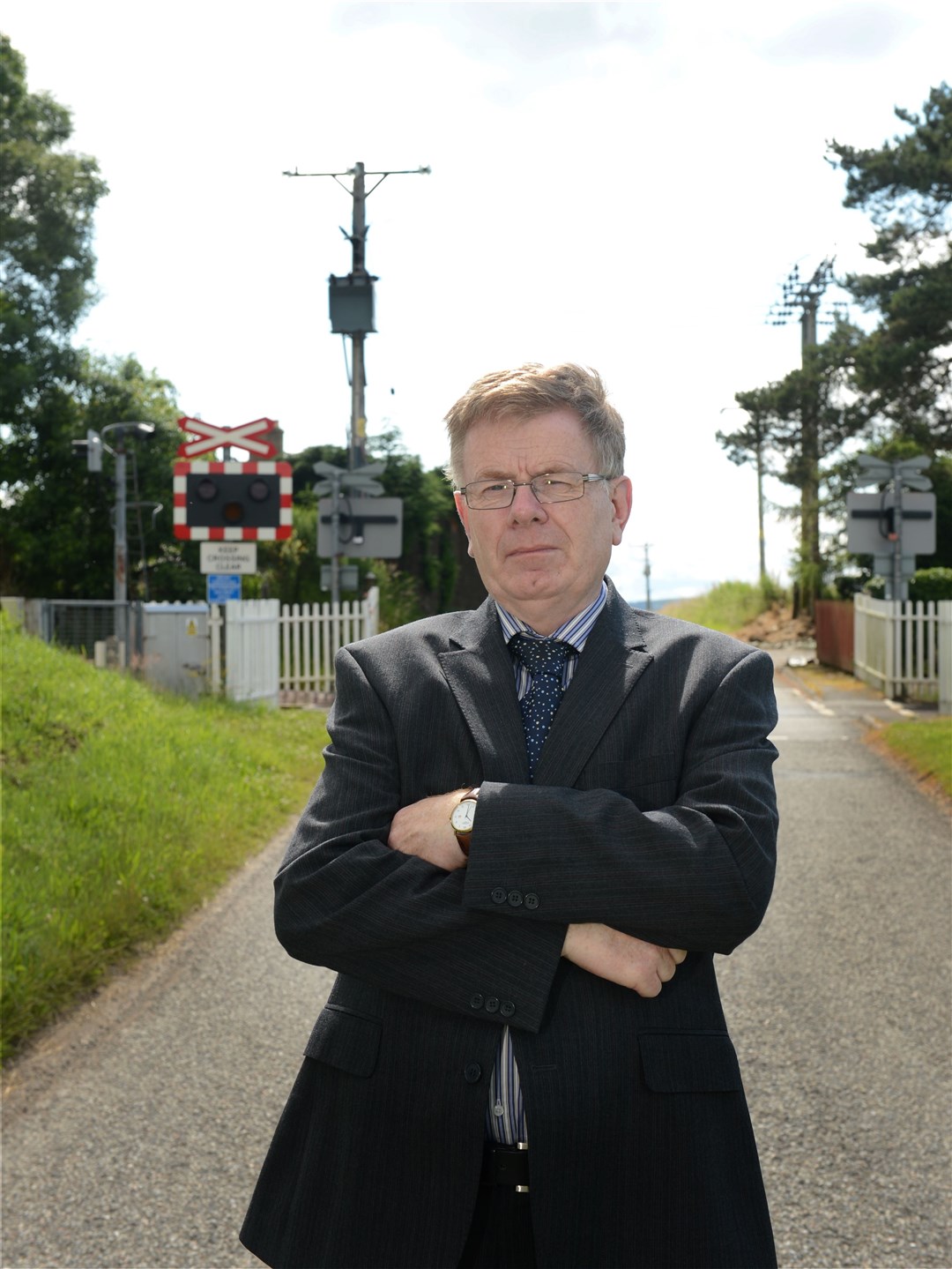 Councillor Alasdair Rhind by the Delny level crossing. The road between Barbaraville and the A9 has been threatened with closure after concerns about the safety of the level crossing..Picture: Alison White. Image No.029828.