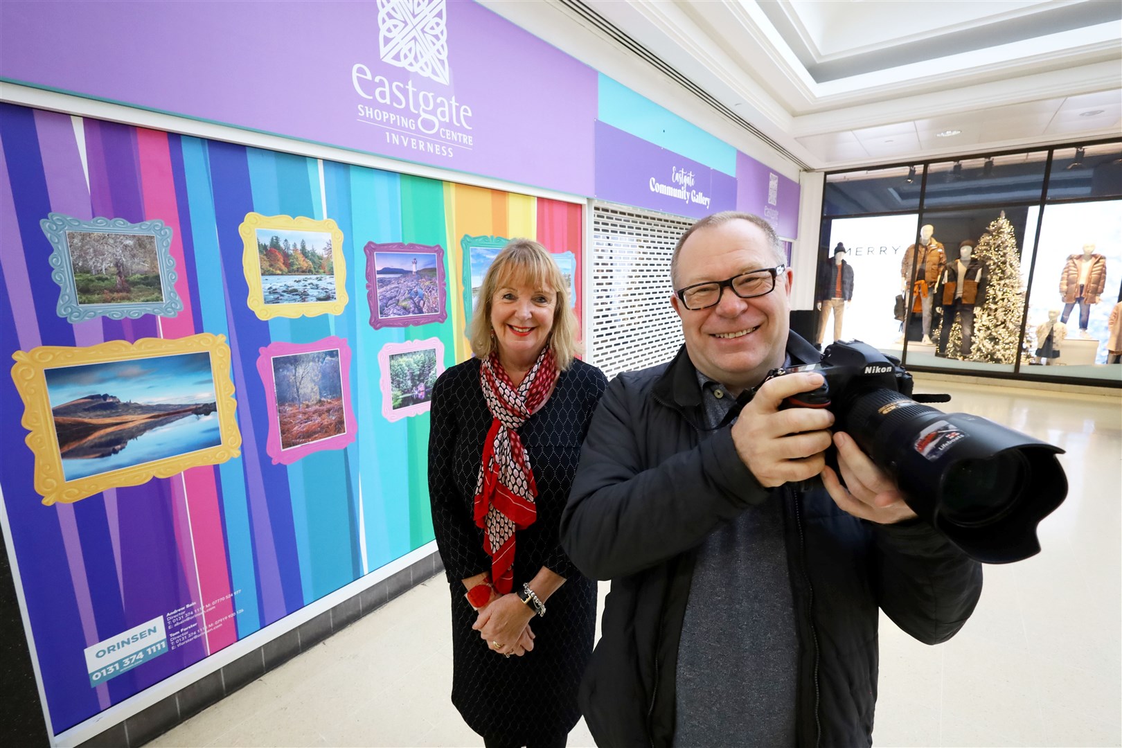 Photographer John Frid and Eastgate Shopping Centre manager Jackie Cuddy take a look at the exhibition.
