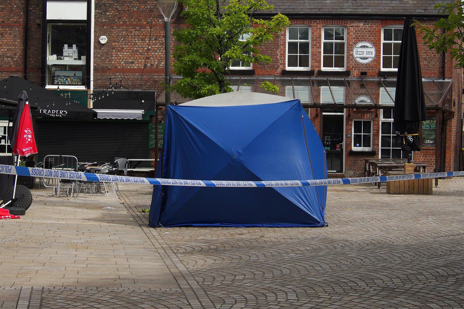 A police tent at the scene in Trafford where Rico Burton was stabbed to death (Peter Byrne/PA)