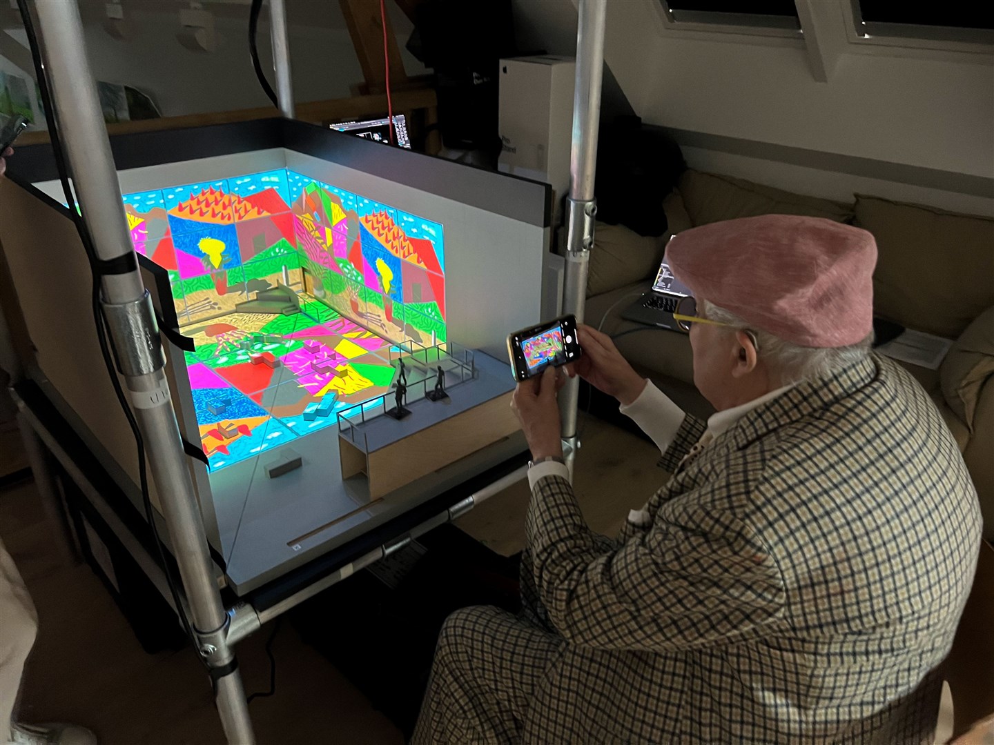David Hockney viewing the model box containing August 2021, Landscape with Shadows, twelve iPad paintings comprising a single work (Mark Grimmer/PA)