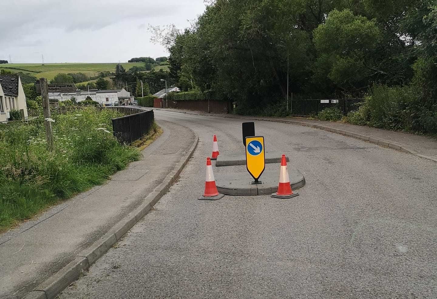 The Back Road traffic island, located close to a turn in the road, is to be moved further toward the junction with Strathpeffer Road.