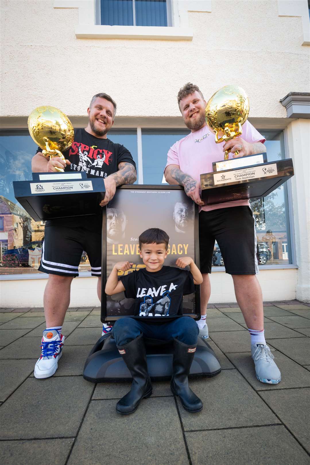 Luke and Tom Stoltman with Jayden Timoney outside their Invergordon shop. The brothers have weighed in on several occasions on the importance of good mental health. Picture: Callum Mackay..