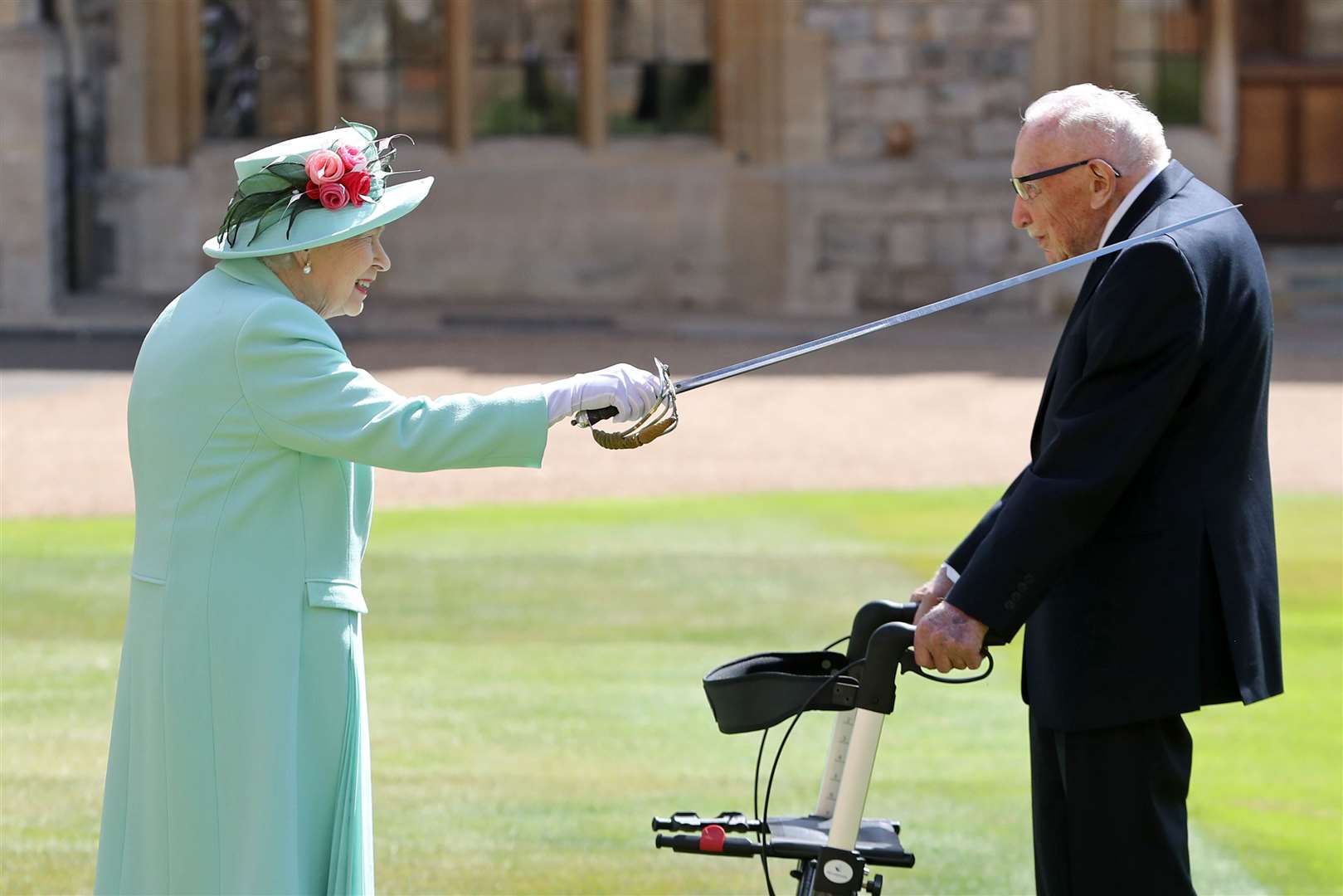 Captain Sir Thomas Moore receives his knighthood from the Queen (Chris Jackson/PA)