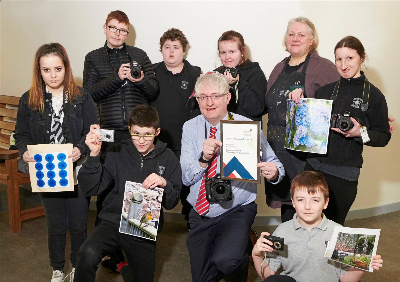 Scott Jeffrey, from Johnston Carmichael, with the Dingwall Academy pupils.