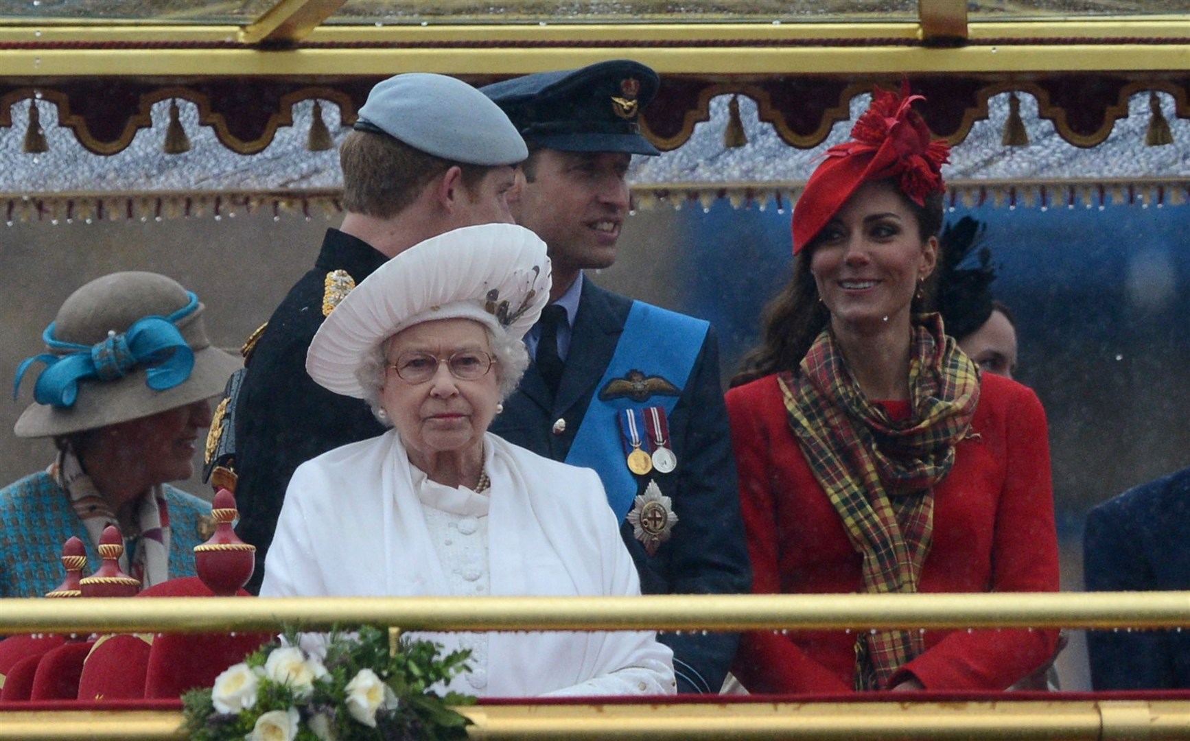 The Queen with the Duke of Sussex and the Duke and Duchess of Cambridge on the royal barge Spirit of Chartwell during the Diamond Jubilee River Pageant (Adrian Dennis/PA)