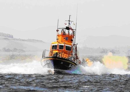 Invergordon lifeboat crew aided the rescue of two stranded teenagers.