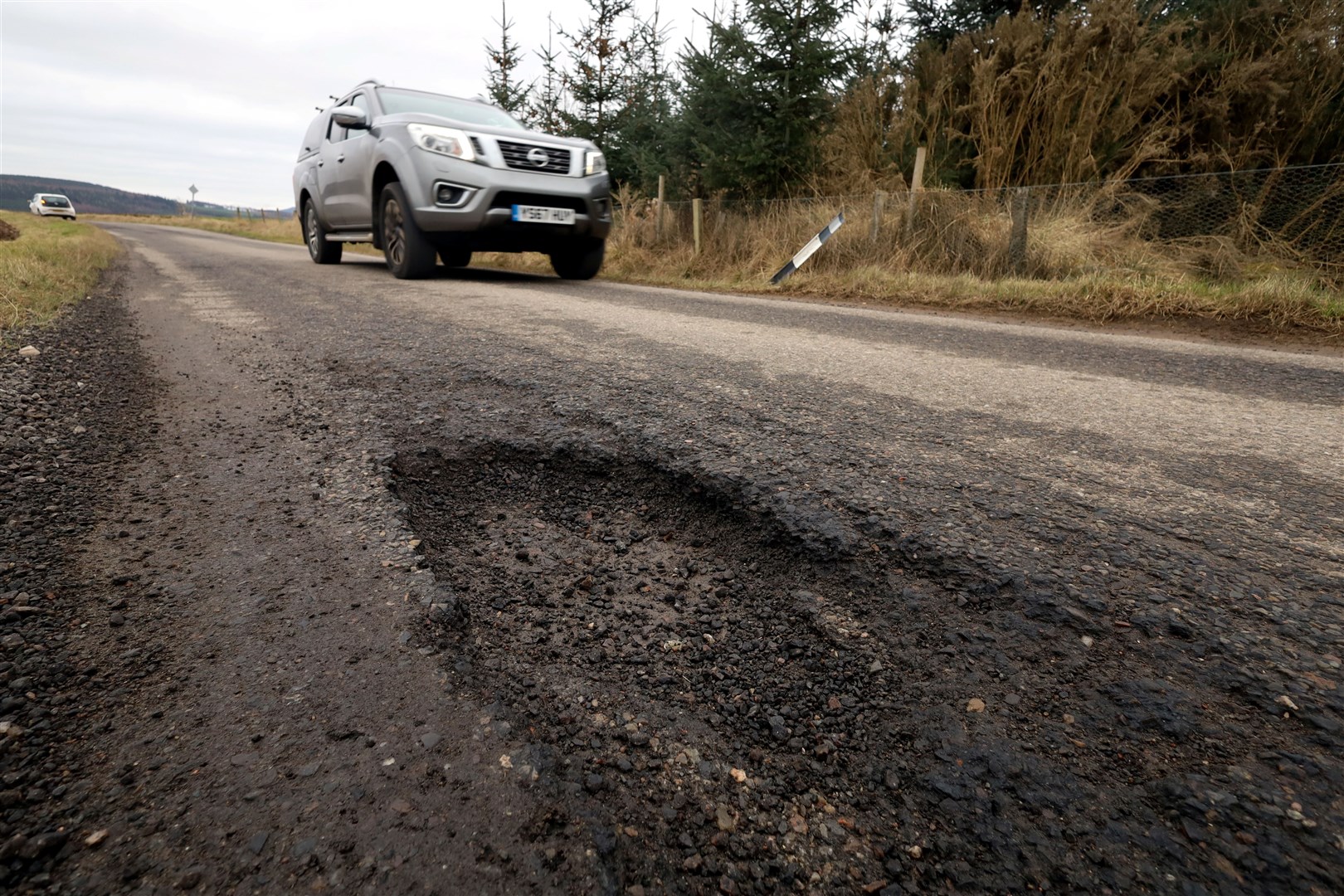 Potholes on the road between Belmaduthy and Munlochy. Picture: James Mackenzie.