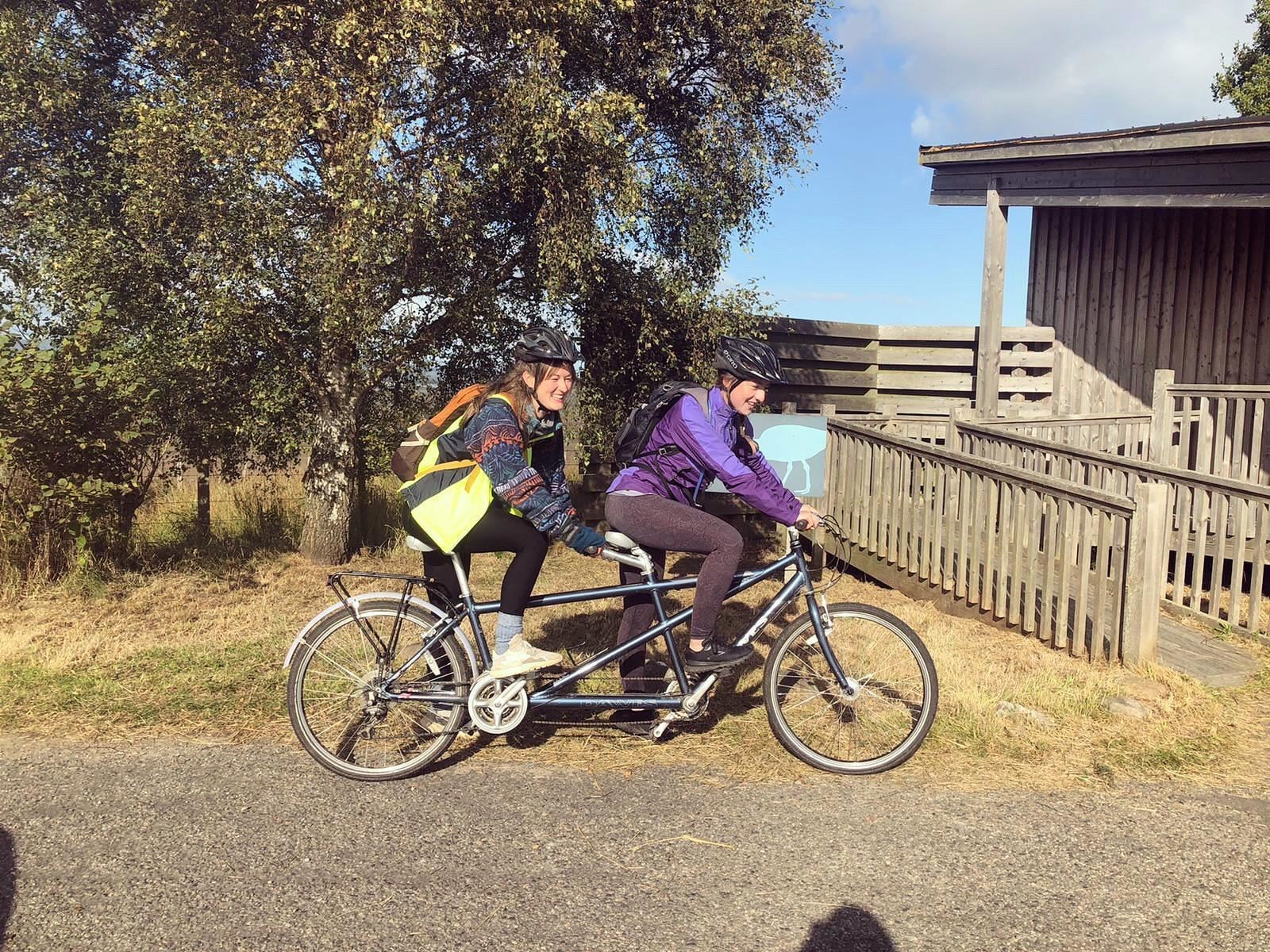 The two women completed the final miles on a tandem.