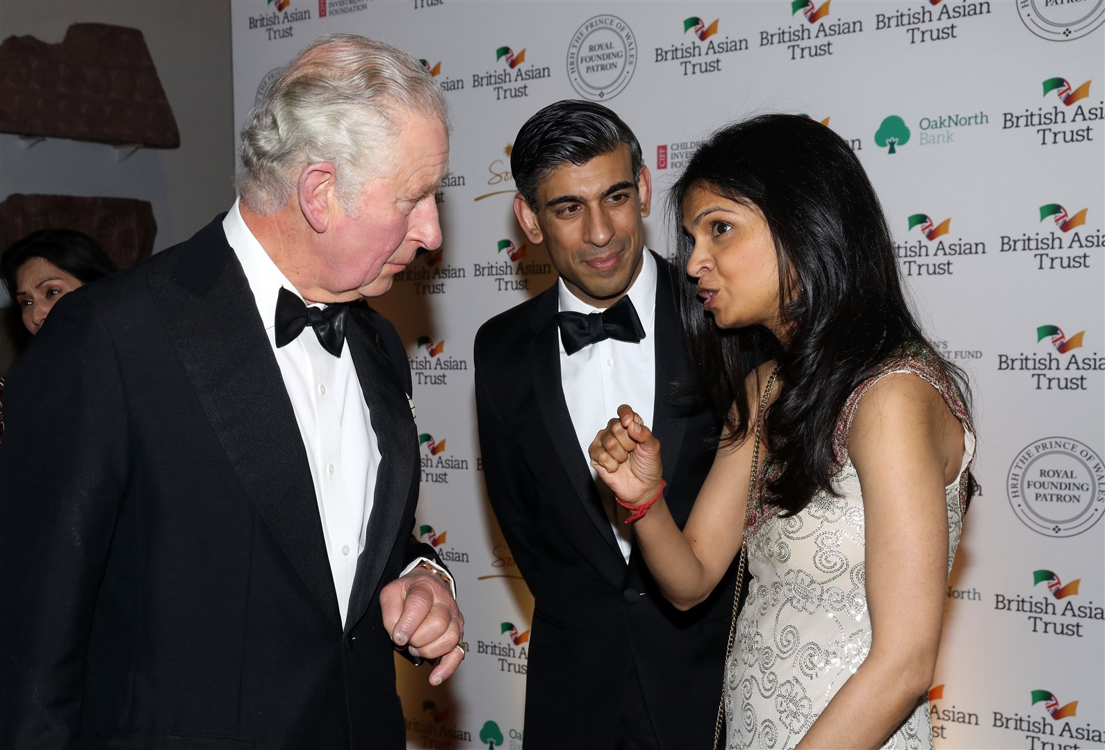 Charles speaks to Rishi Sunak and his wife, Akshata Murty, at a reception celebrating the British Asian Trust (Tristan Fewings/PA)