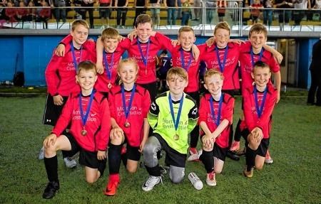 Dingwall Primary Soccer Sevens celebrate after winning the Scottish School Football Association National Final.