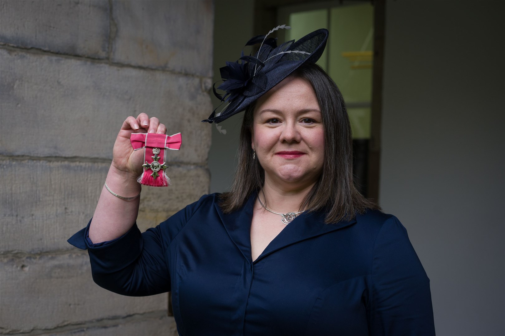Dr Kirsty Cole with her MBE.