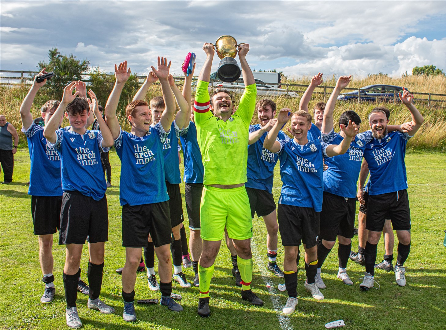 Lochbroom lifted the Kenny Raigie trophy after beating Tain Thistle 3–1. Photo: Niall Harkiss