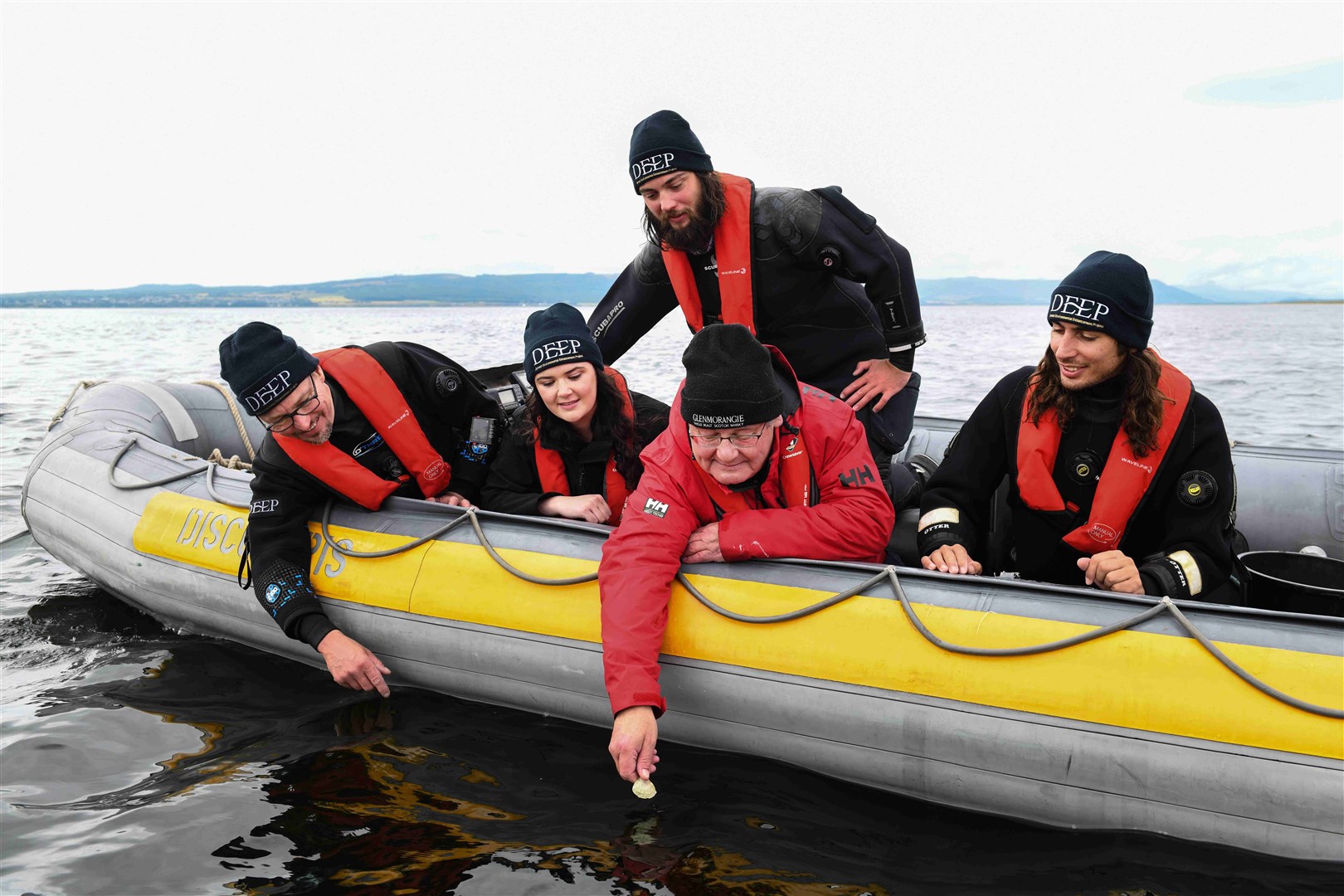 HWU scientist team and Hamish Torrie, CSR Communications Director at Glenmorangie celebrate the deployment of the 20,000th oyster into the Dornoch Firth