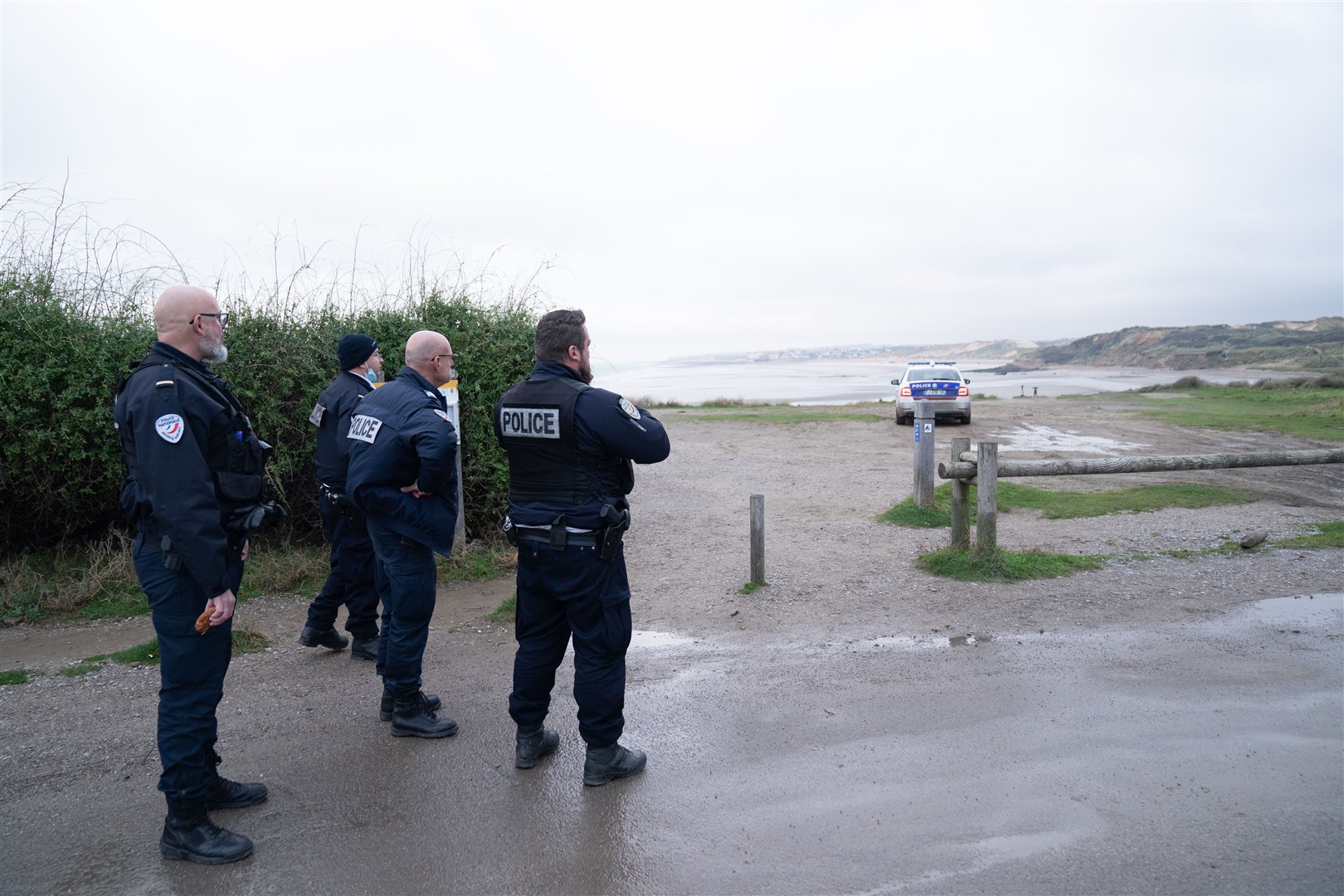 French police look out over a beach near Wimereux believed to be used by migrants trying to get to the UK (Stefan Rousseau/PA)