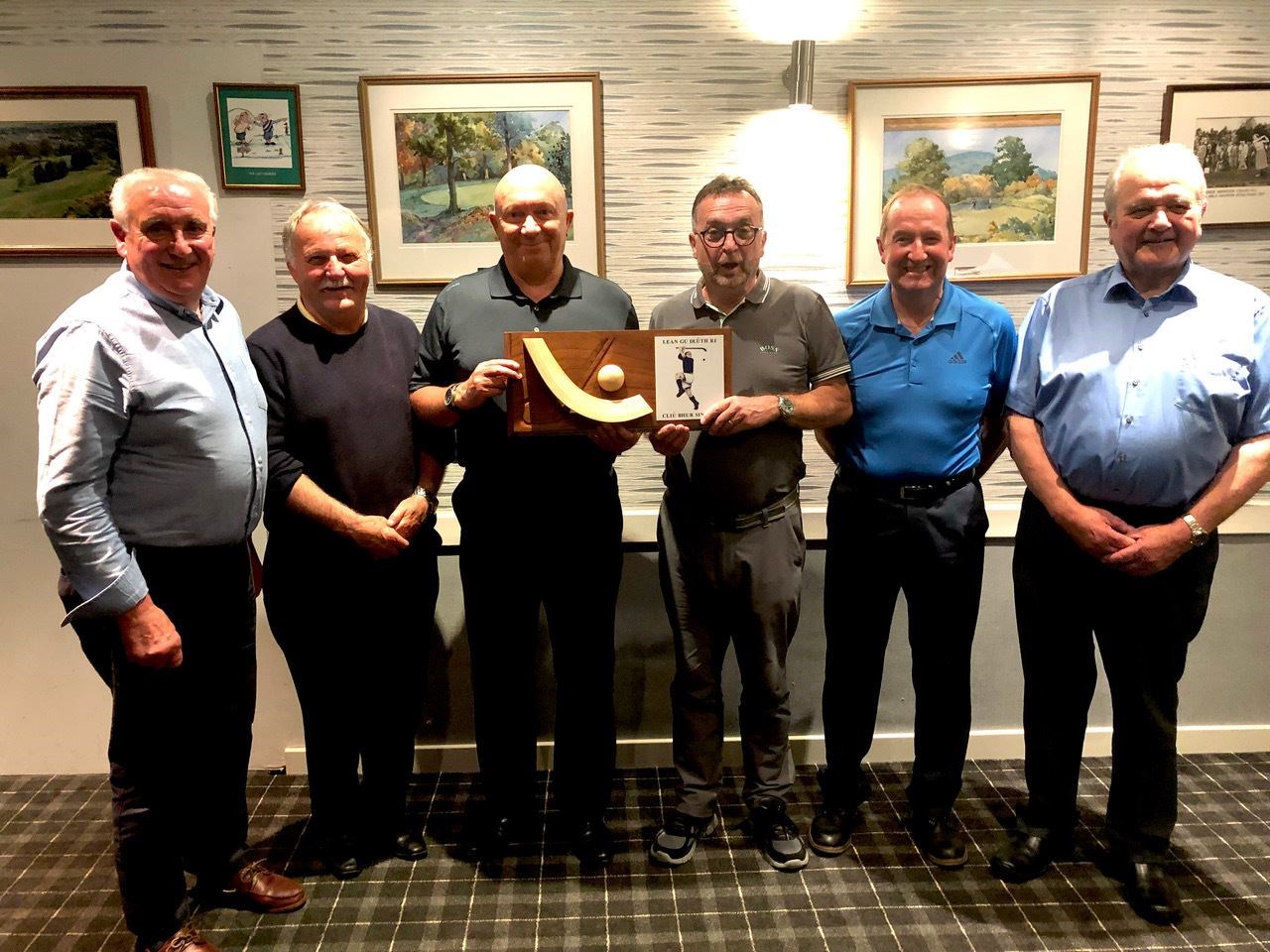 The winning team with the trophy andJohn MacKenzie MBE (far left) along with David MacMaster (far right).