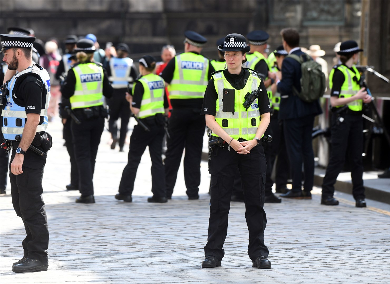 Police on the Royal Mile ahead of the King’s arrival for the service of thanksgiving (PA)