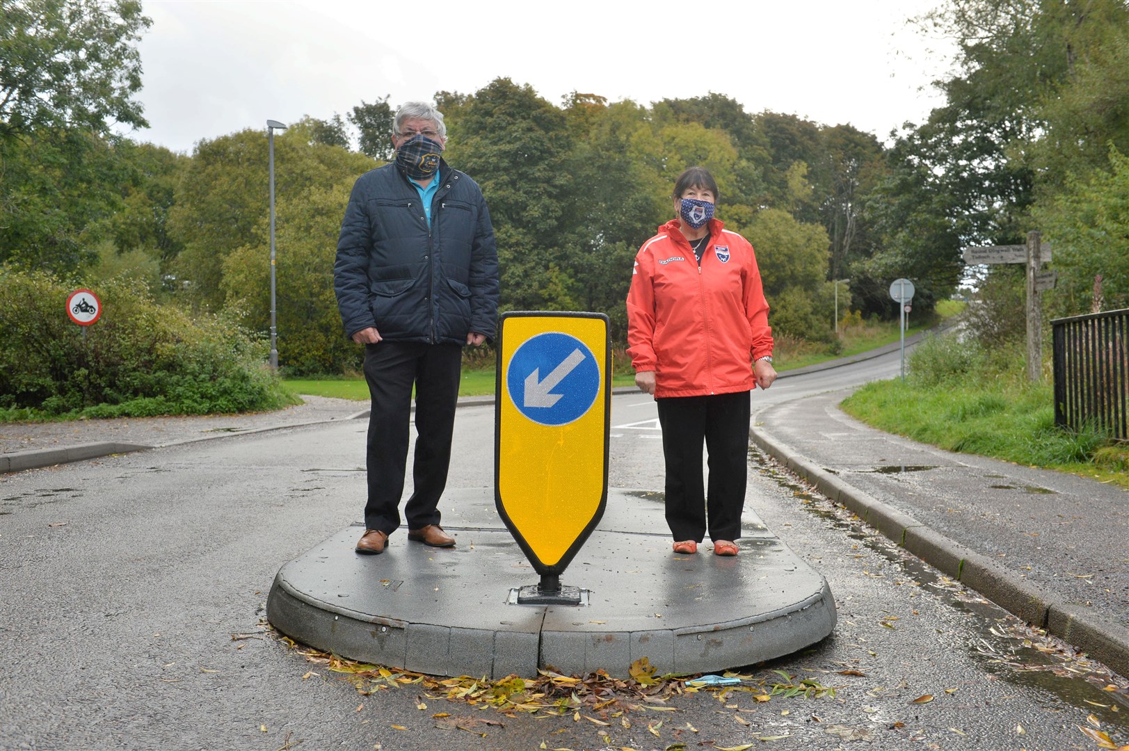 Councillors Graham MacKenzie and Councillor Margaret Paterson at one of the controversial traffic islands on Dingwall's Back Road.
