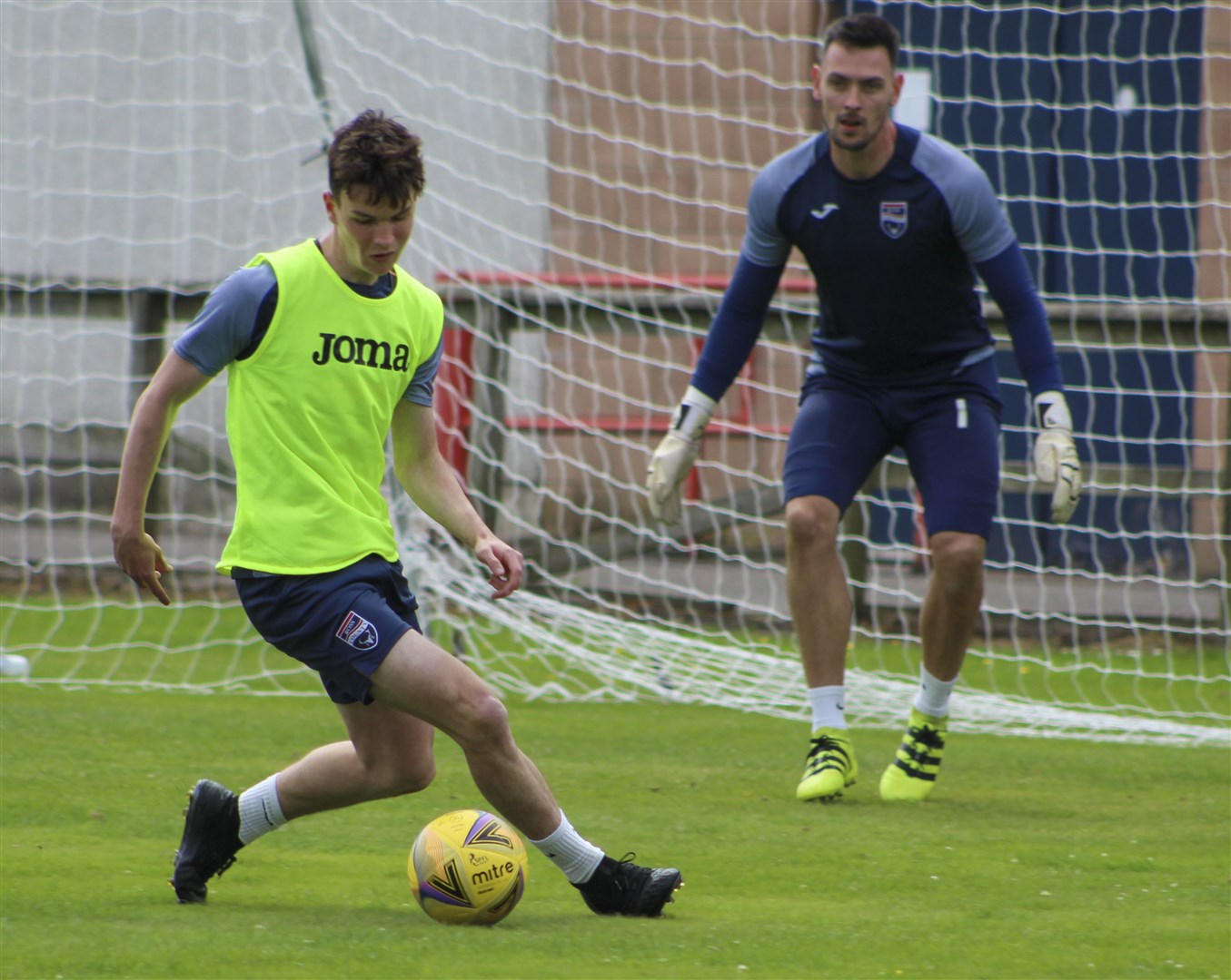 Ryan MacLeman (left) pictured in training with Ross County.