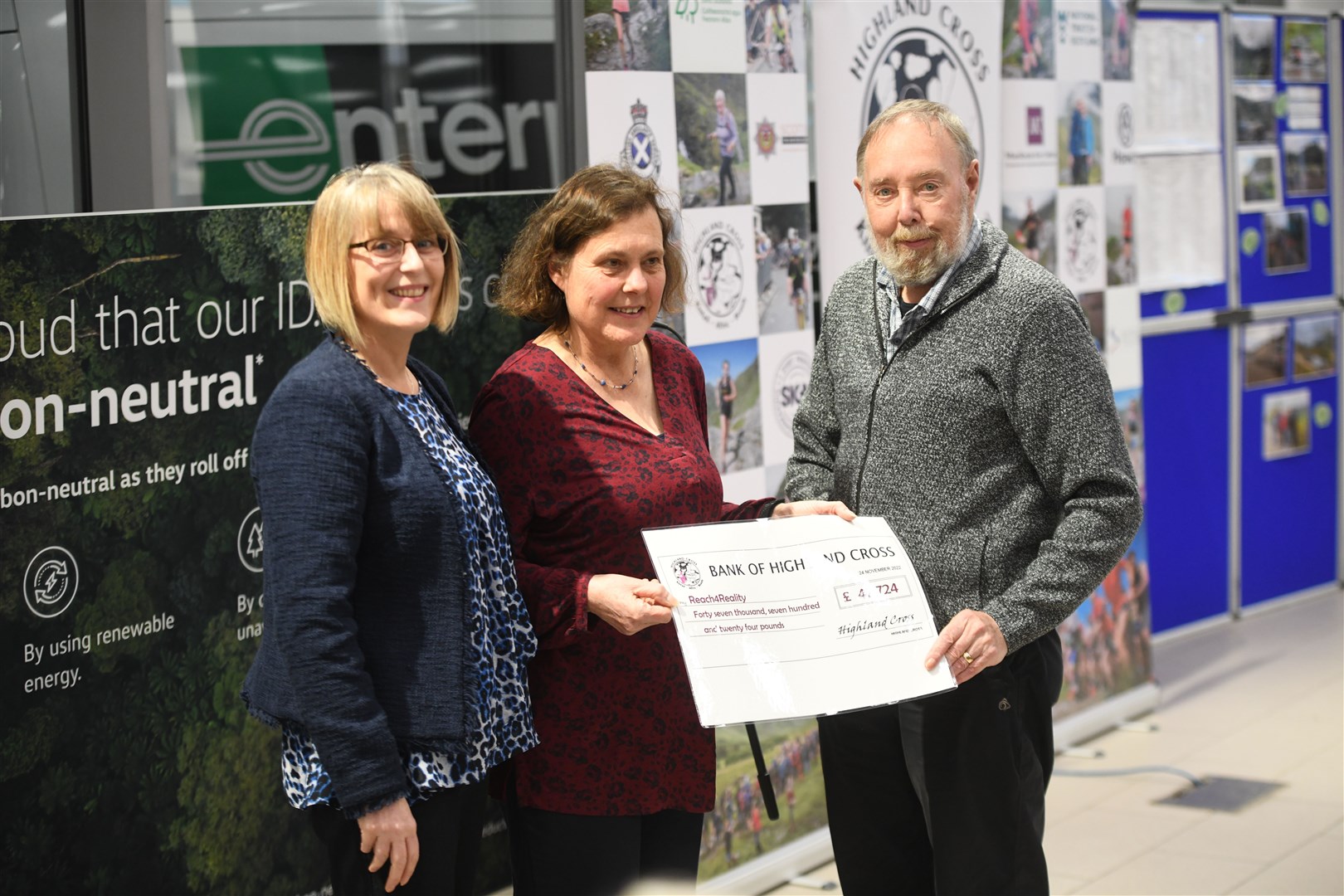 Amanda Dunn and Sylvia Longbottom of Reach4Reality receive their cheque from John Findlayson. Picture: James Mackenzie