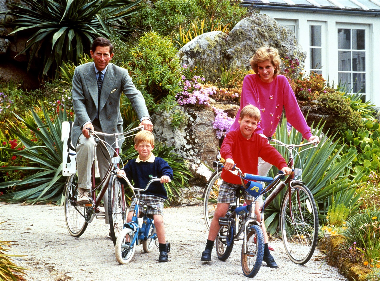 The Waleses prepare for a cycle ride in Tresco during their holiday in the Scilly Isles in 1989 (PA)