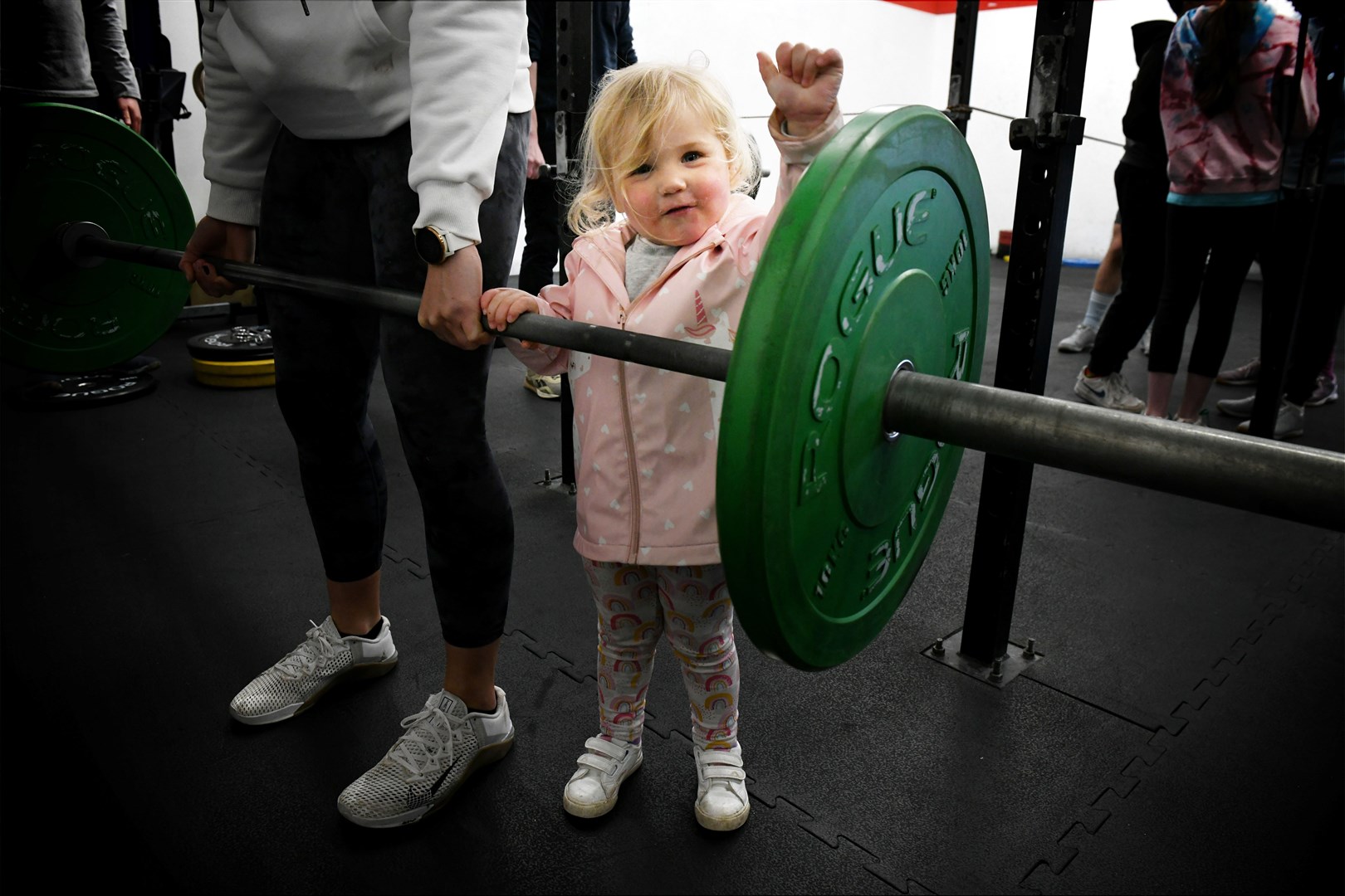 Mia Stewart, who is two and a half years old, deadlifting with one hand. Picture: James Mackenzie