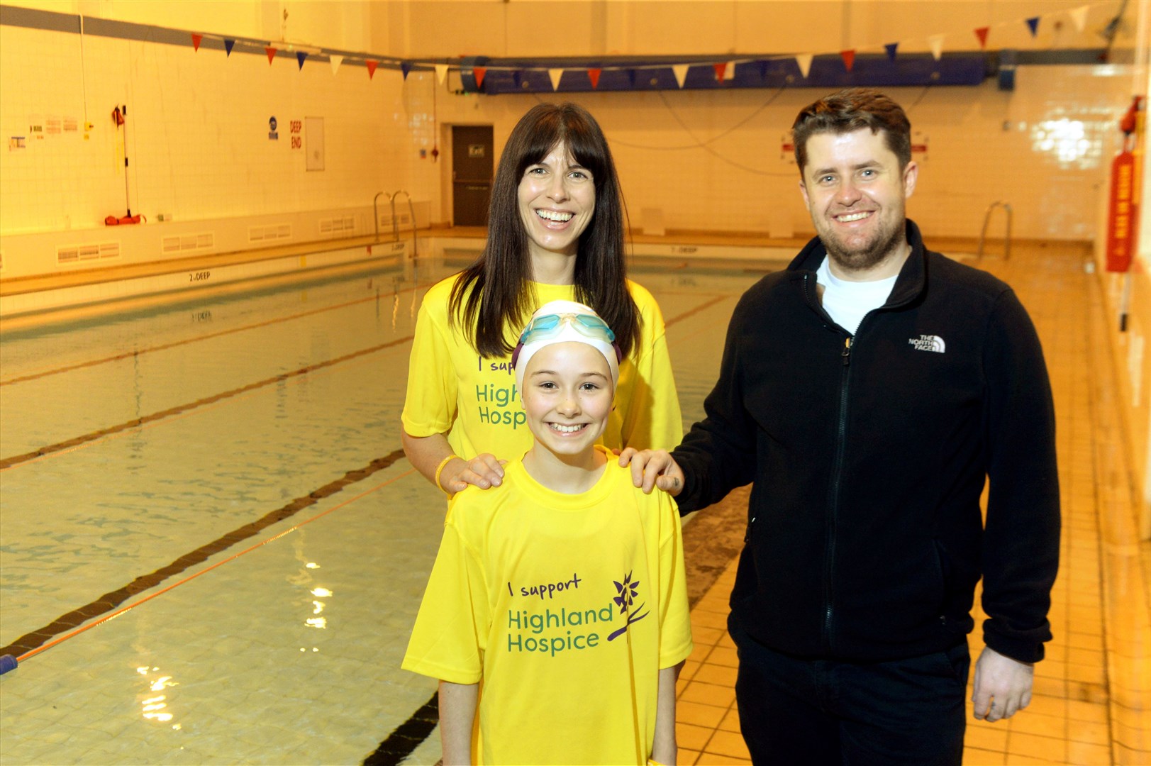 Sophie Stewart took on a sponsored swim in memory of a much-loved relative. She is pictured with mum Audrey Stewart, and Andrew Clark, Dingwall Swimming Club head coach. Picture: James Mackenzie