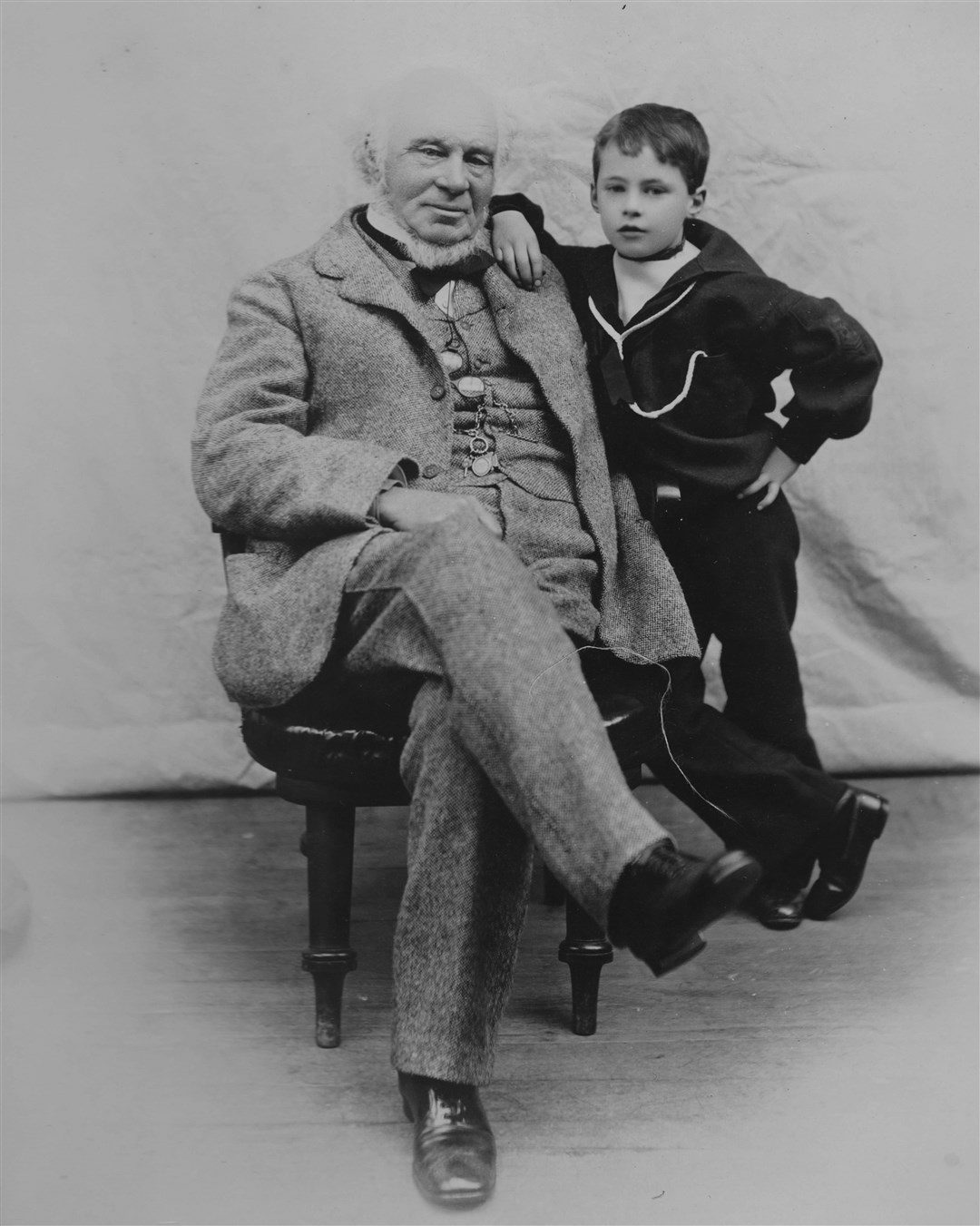 Sir John Fowler, railway engineer and co-designer of the Forth Road Bridge, seen here around 1895 with his grandson. Collection of Peter Newling, Ullapool.