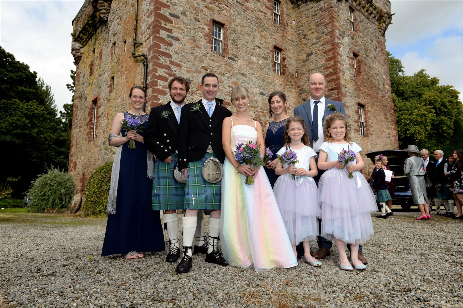 Ashley Traill (nee MacLennan) and groom Neil with (from left) bridesmaid Sophie Bryan, best man Neil Traill, bridesmaid Xanthe MacLeod, Simon MacLeod, and flower girls Hailey and Emily MacLeod. Picture: James Mackenzie