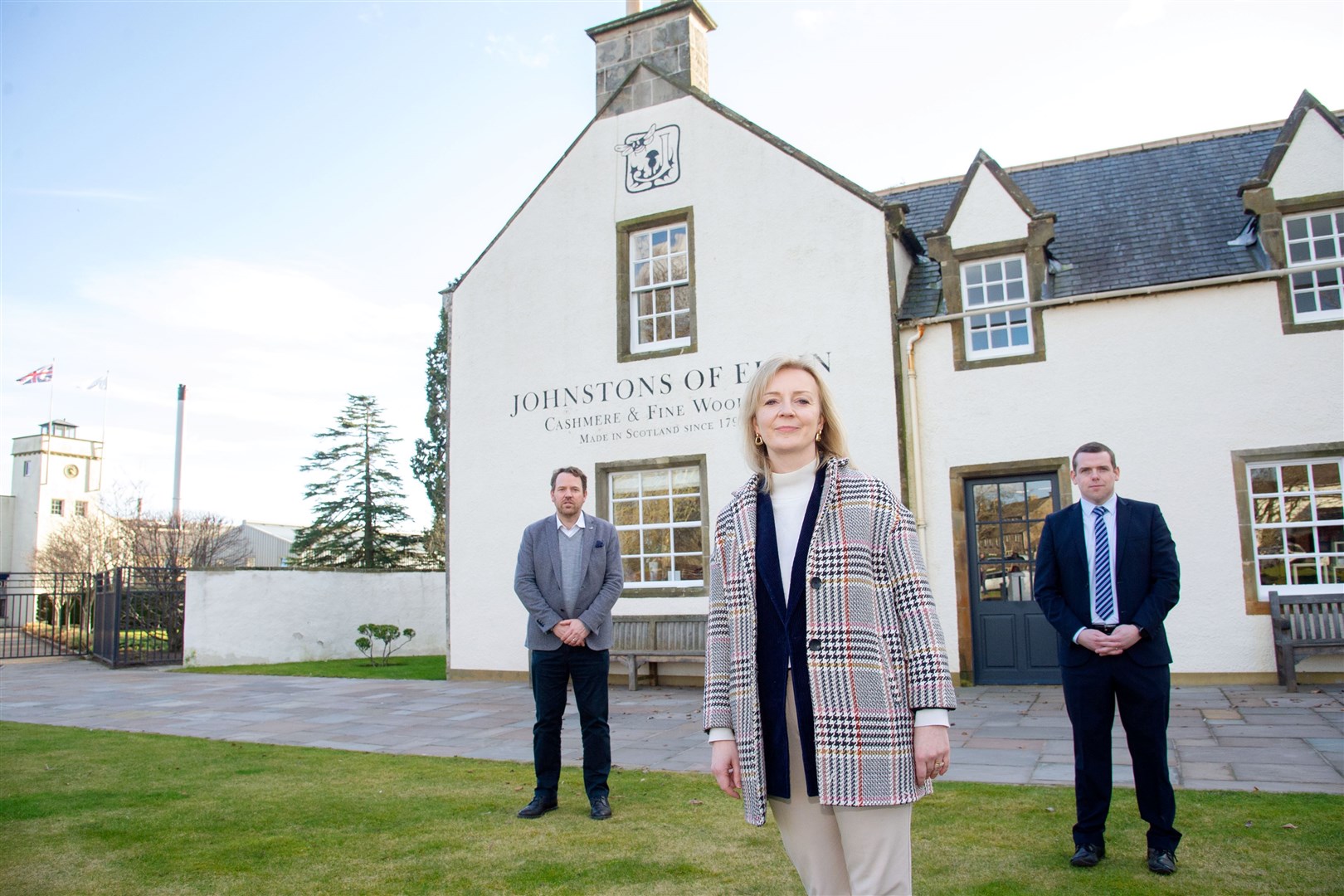 Liz Truss pictured with (right) Simon Cotton, chief executive of Johnstons of Elgin and Moray MP and Scottish Conservative leader Douglas Ross at an earlier visit to the area. Picture: Daniel Forsyth