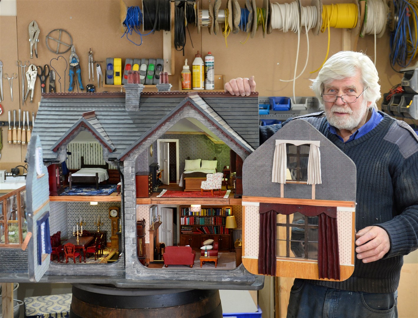 Mr Howker spent hundreds of hours making the doll's house during lockdown. Picture: Gary Anthony