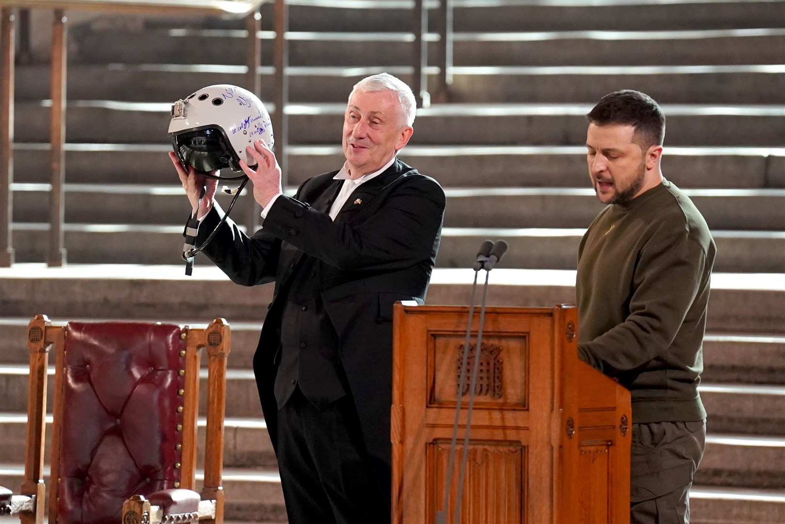 Sir Lindsay Hoyle holds the helmet of a Ukrainian fighter pilot, presented to him by Mr Zelensky, inscribed with the words: ‘We have freedom, give us wings to protect it’ (Stefan Rousseau/PA)
