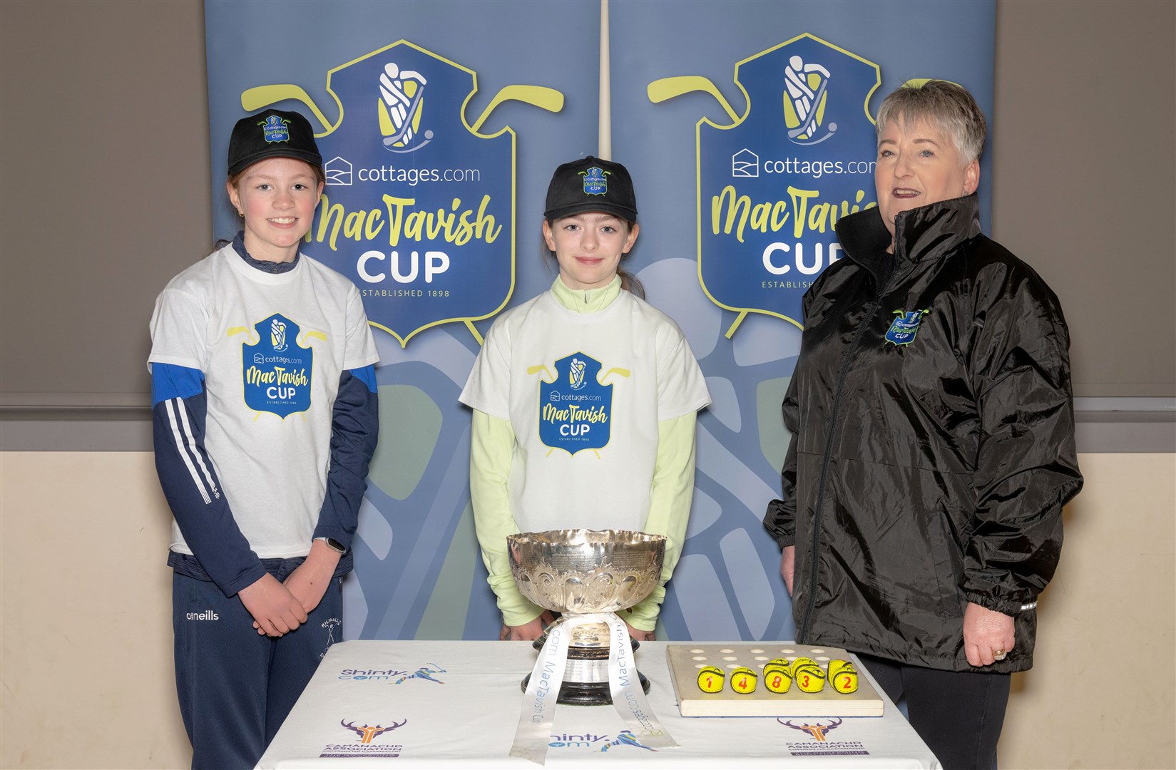Maisie Ewing & Taylor Cameron (Kilmallie) alongside Heather Grant from sponsors cottages.com after the quarter-final draw. Picture: Neil Paterson